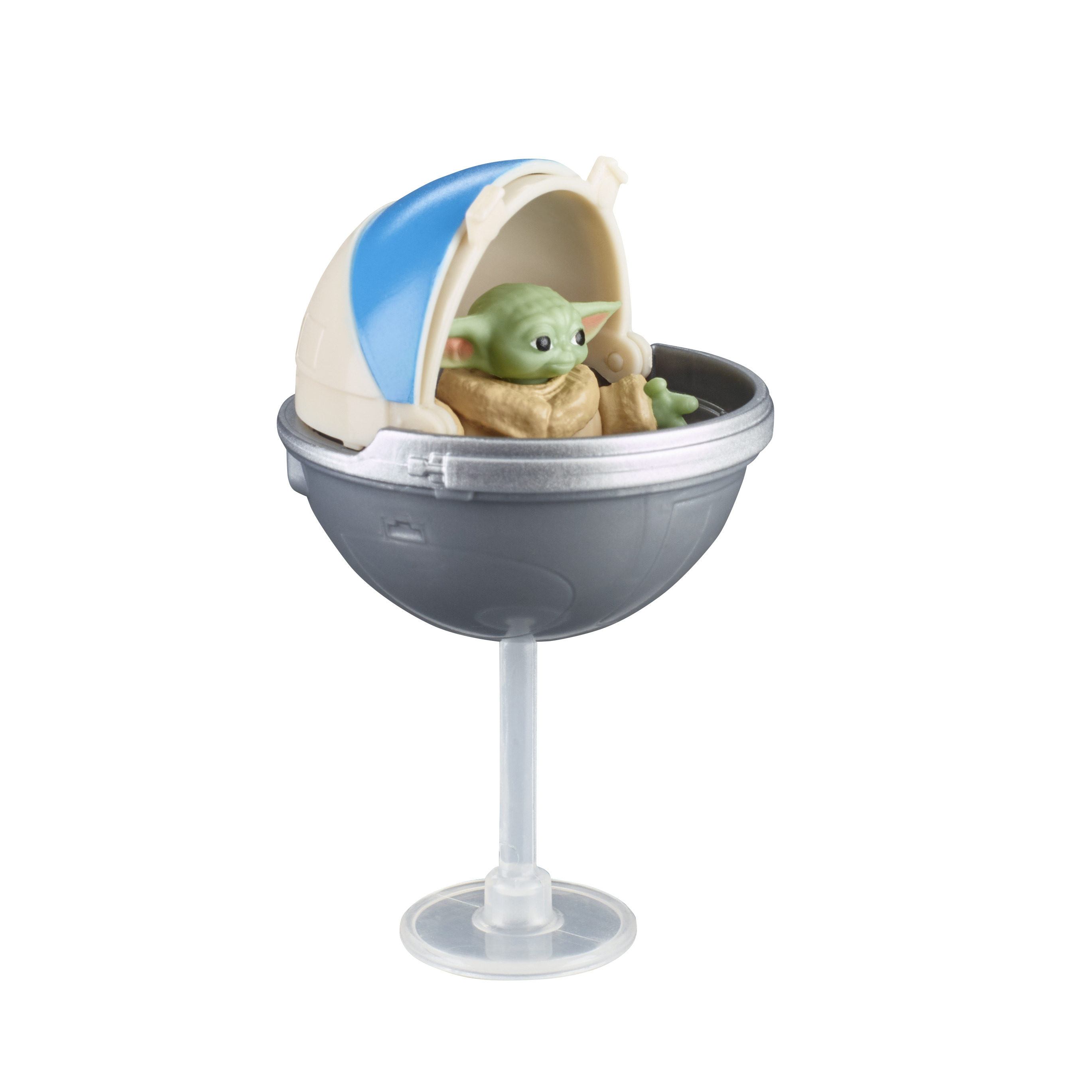 Figurka Baby Yody w kapsule, na stojaku. Yoda jest zielony, a kapsuła szara i niebieska.