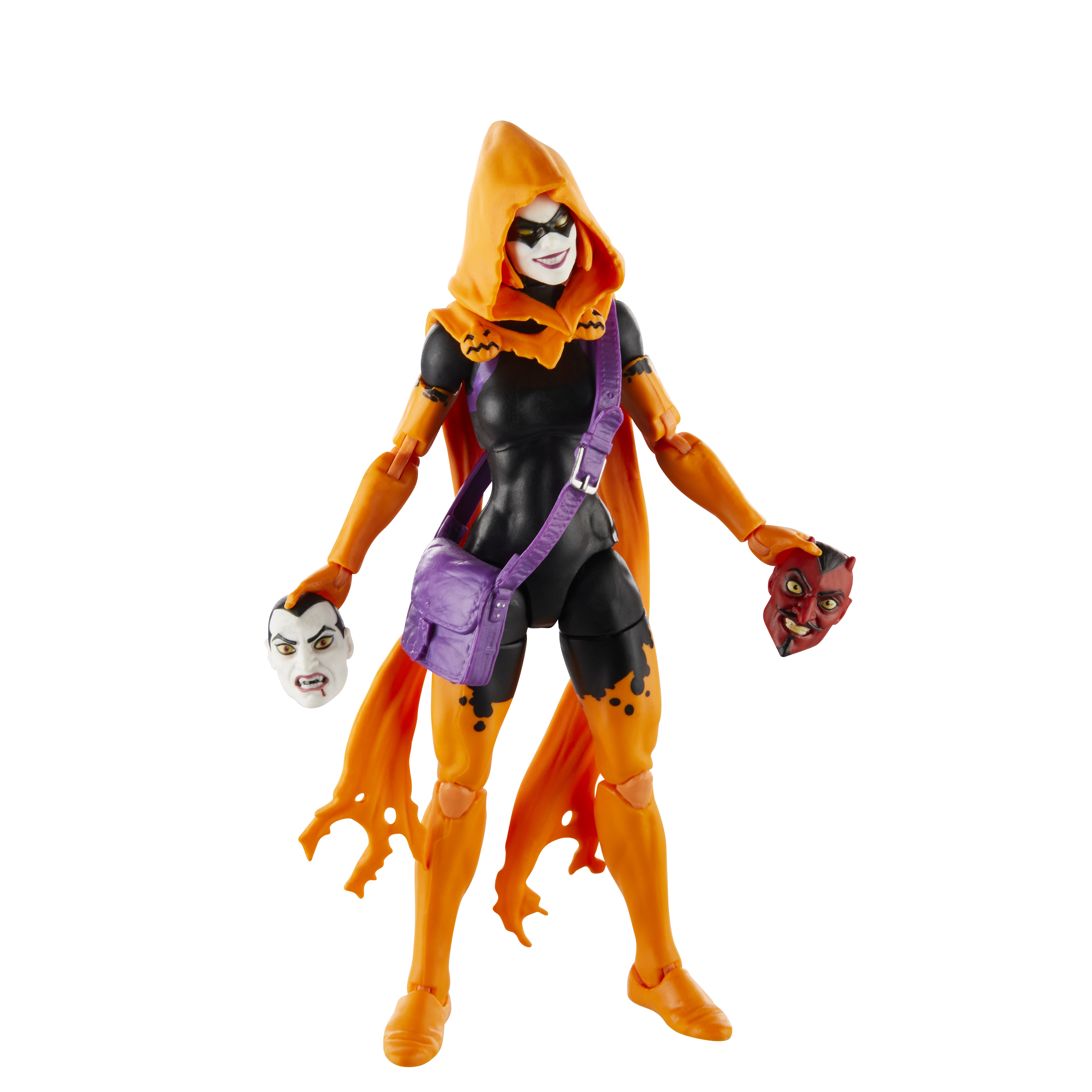 Action figure: personaggio con cappuccio arancione in tuta nera, tiene maschere. Sfondo bianco.