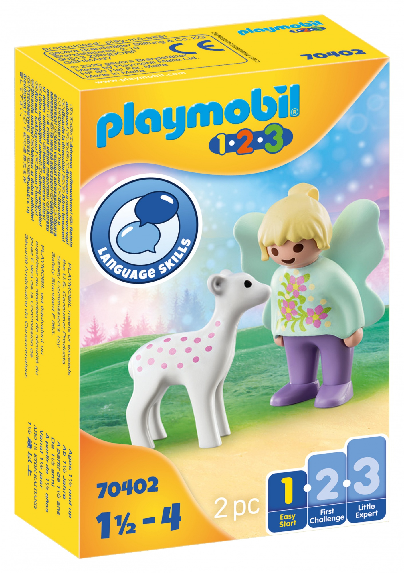 Una scatola Playmobil con una figura di fata e una figura di cervo. Mostra un cielo colorato e alberi.