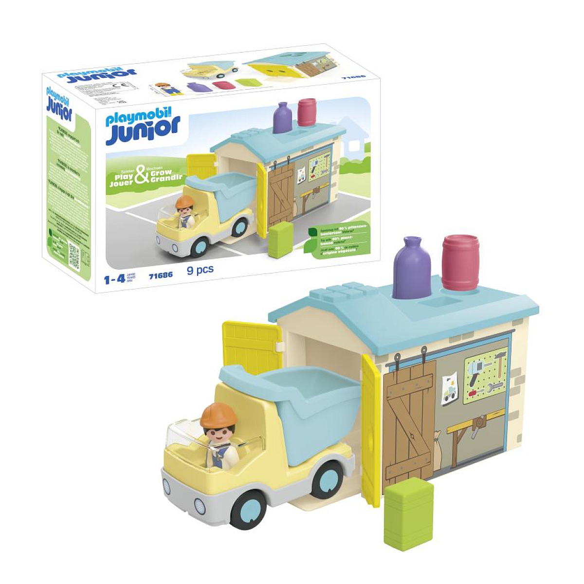 Zestaw zabawek Playmobil Junior z ciężarówką i garażem, z figurkami, na białej powierzchni.