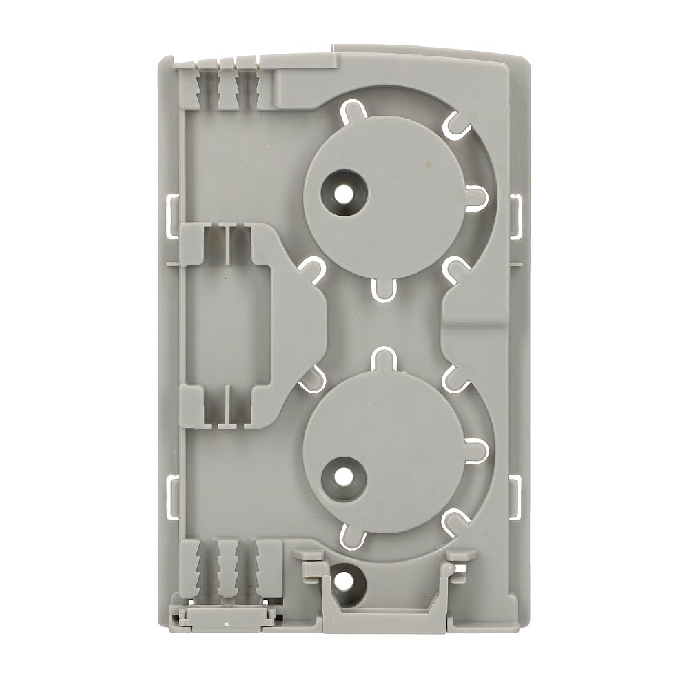 Szare wnętrze obudowy światłowodu z wieloma okrągłymi i prostokątnymi wycięciami.