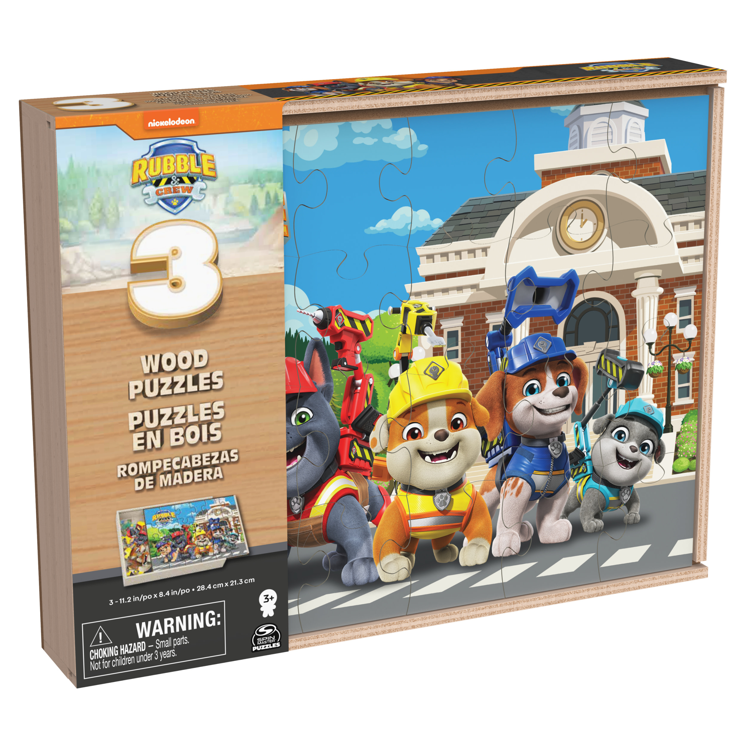 Puzzle de Paw Patrol con los cachorros en una calle frente a un edificio.