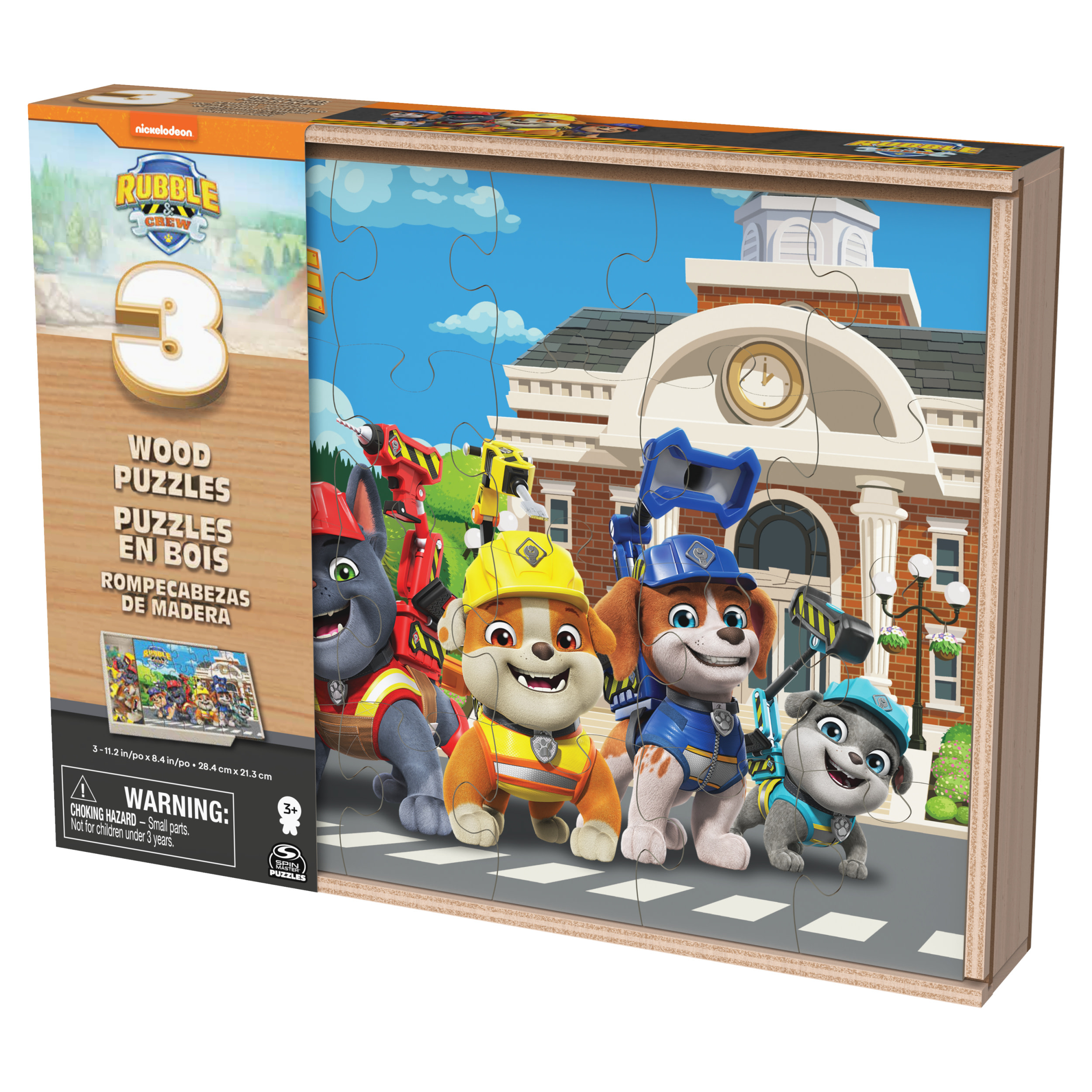 Puzzle de Paw Patrol con los cachorros en una calle frente a un edificio.