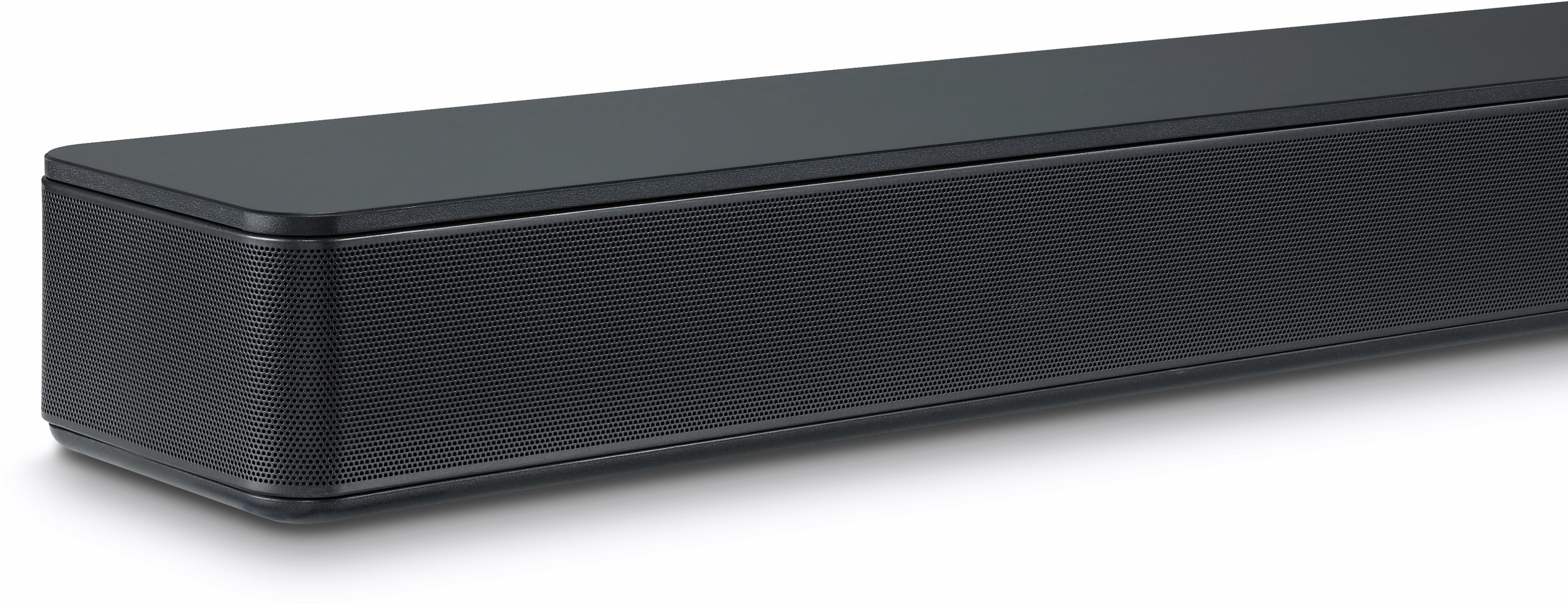 Nahaufnahme des schwarzen Lautsprechergrills einer Soundbar, mit kleinen Perforationen, die die Schallausgabe anzeigen.