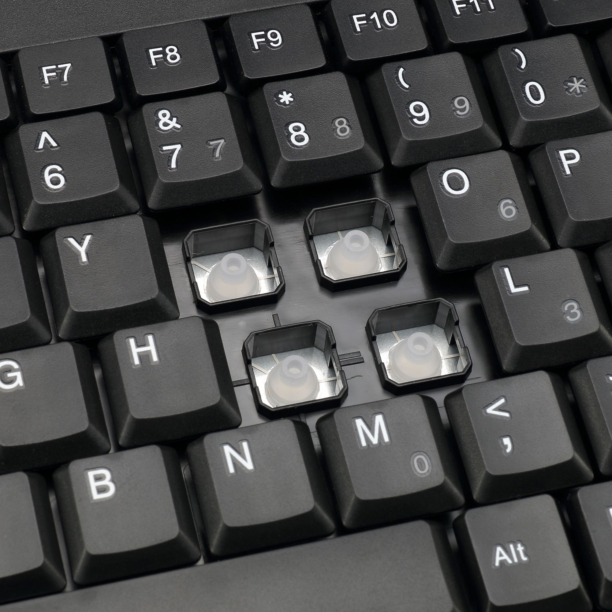 Close-up van toetsenbordtoetsen zonder keycaps, de switches tonend.