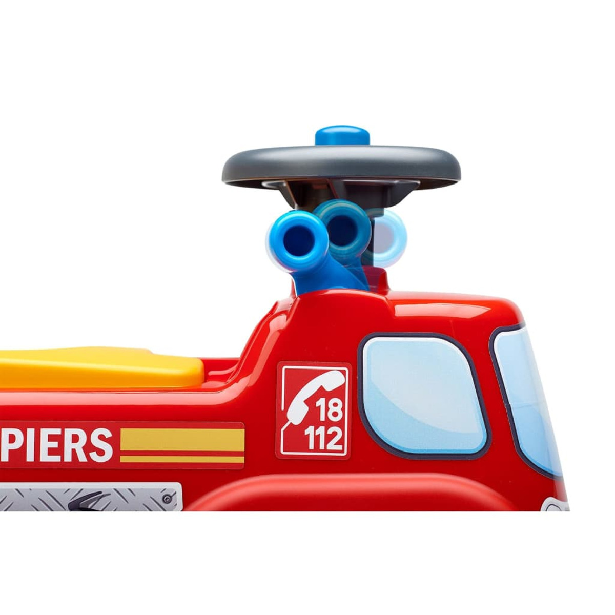 Primo piano di un camion dei pompieri giocattolo rosso con cannoni ad acqua blu e la scritta 'Pompiers'.