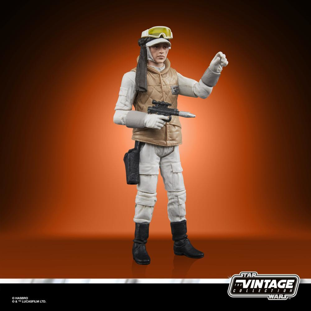 Una action figure di Star Wars di una soldatessa ribelle, con una pistola, su sfondo arancione.