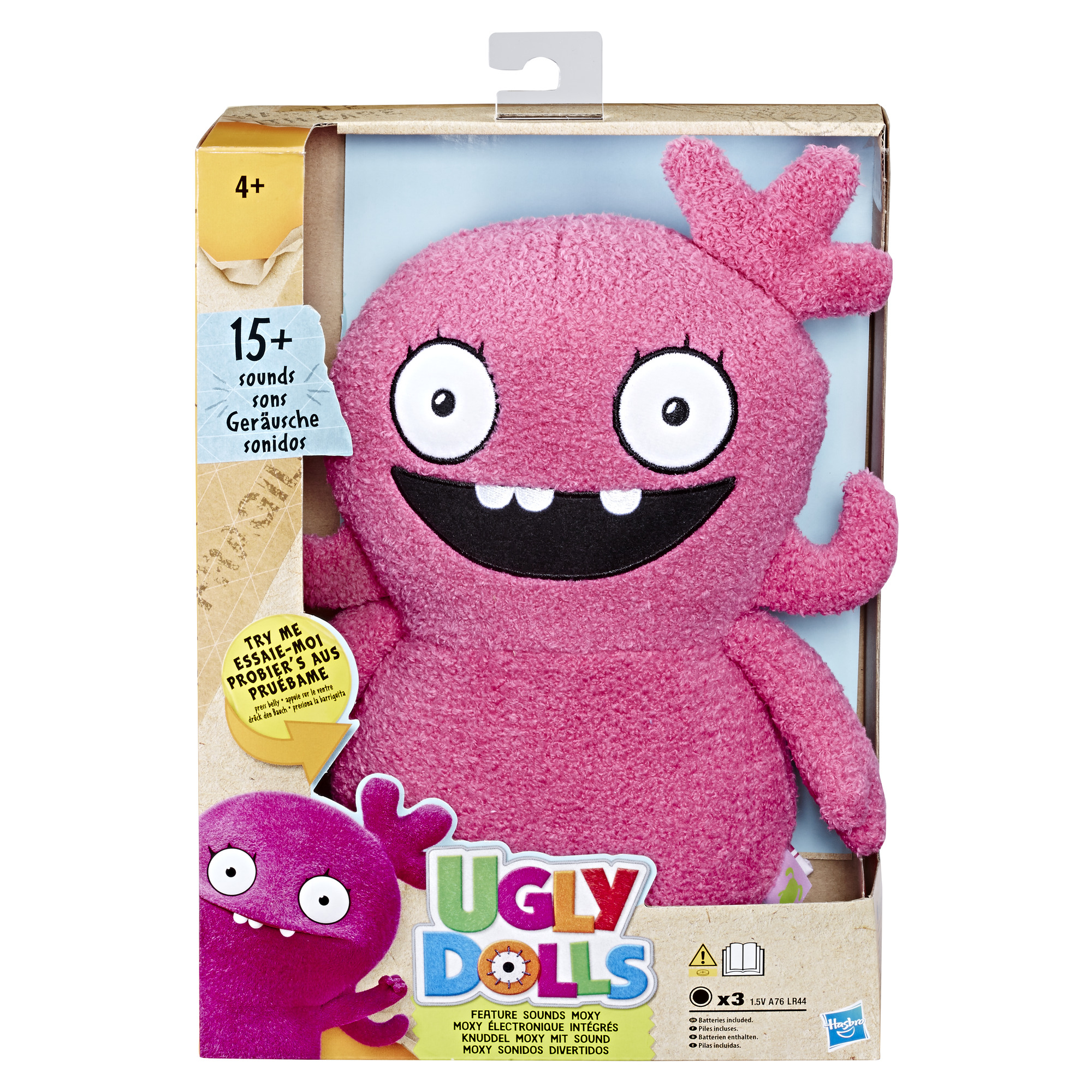 Pudełko Ugly Dolls, różowa lalka z otwartymi ustami i niebieskim tłem.