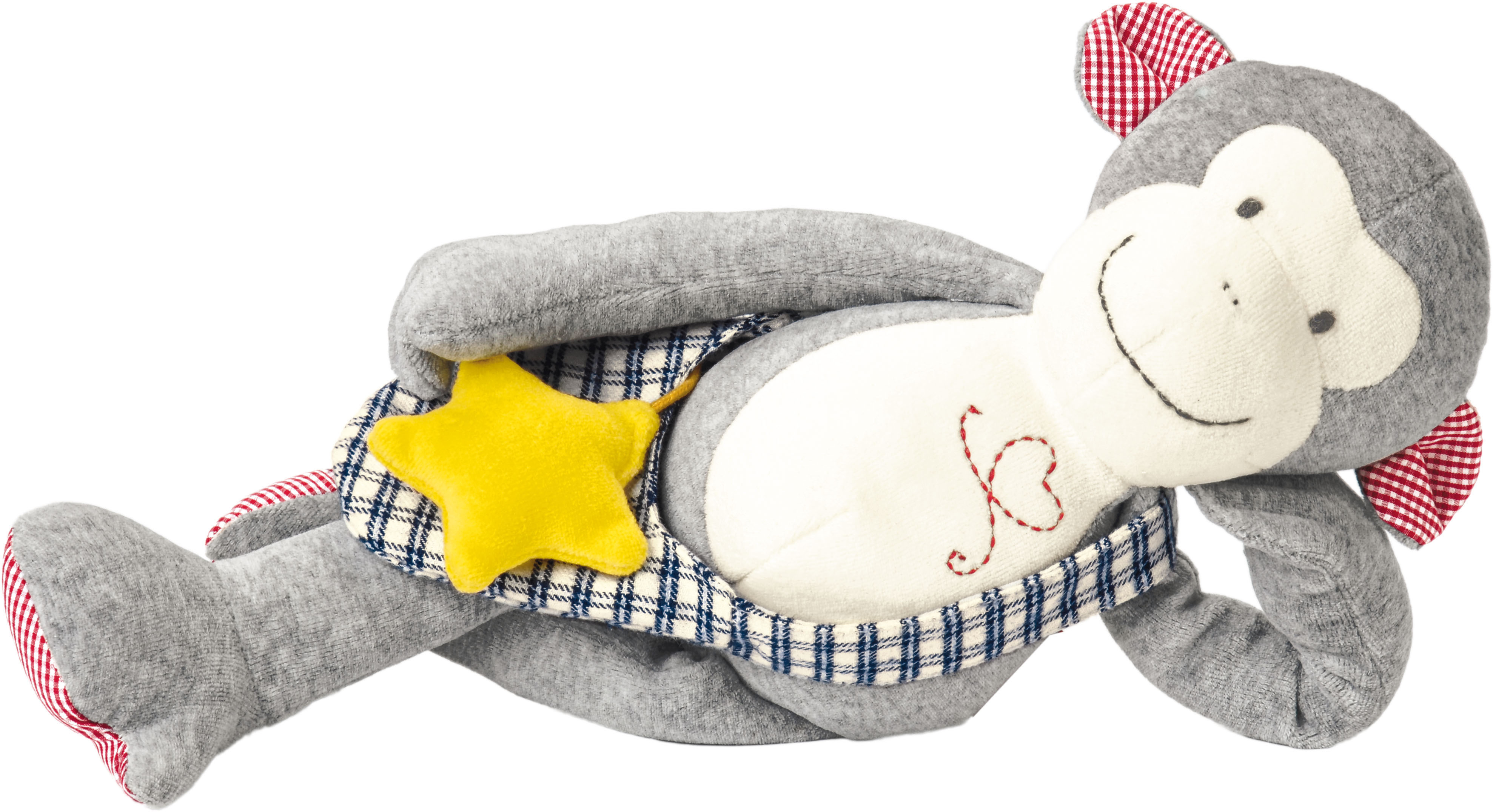 Un juguete de peluche de mono acostado. Tiene pelaje gris, cara blanca y una estrella en el pecho.