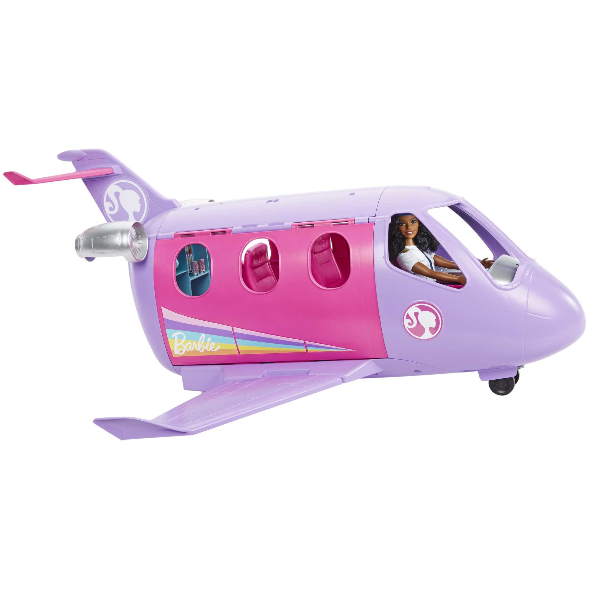 Ein pinkfarbenes und lila Barbie-Flugzeugspielzeug mit einer Barbie-Puppe im Cockpit.