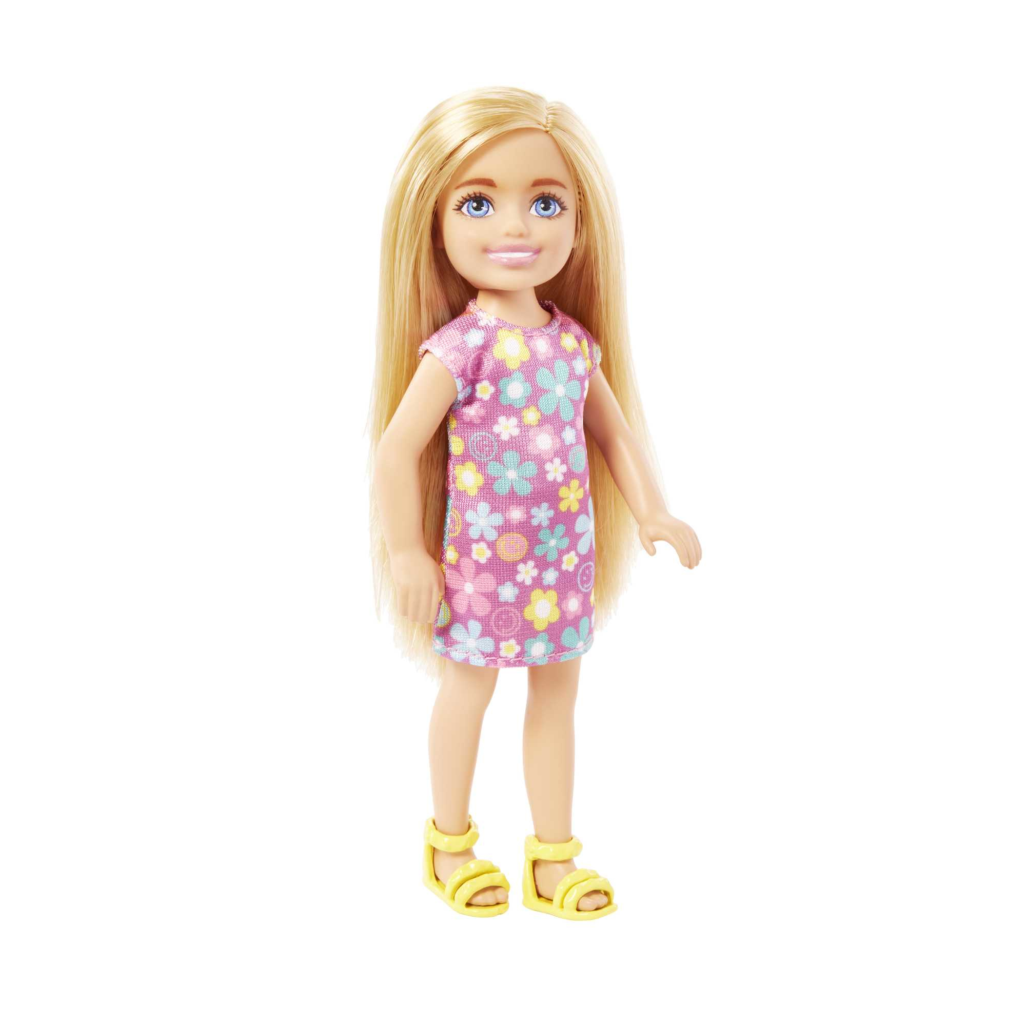 Blonde Puppe mit einem blumigen rosa Kleid und gelben Sandalen.