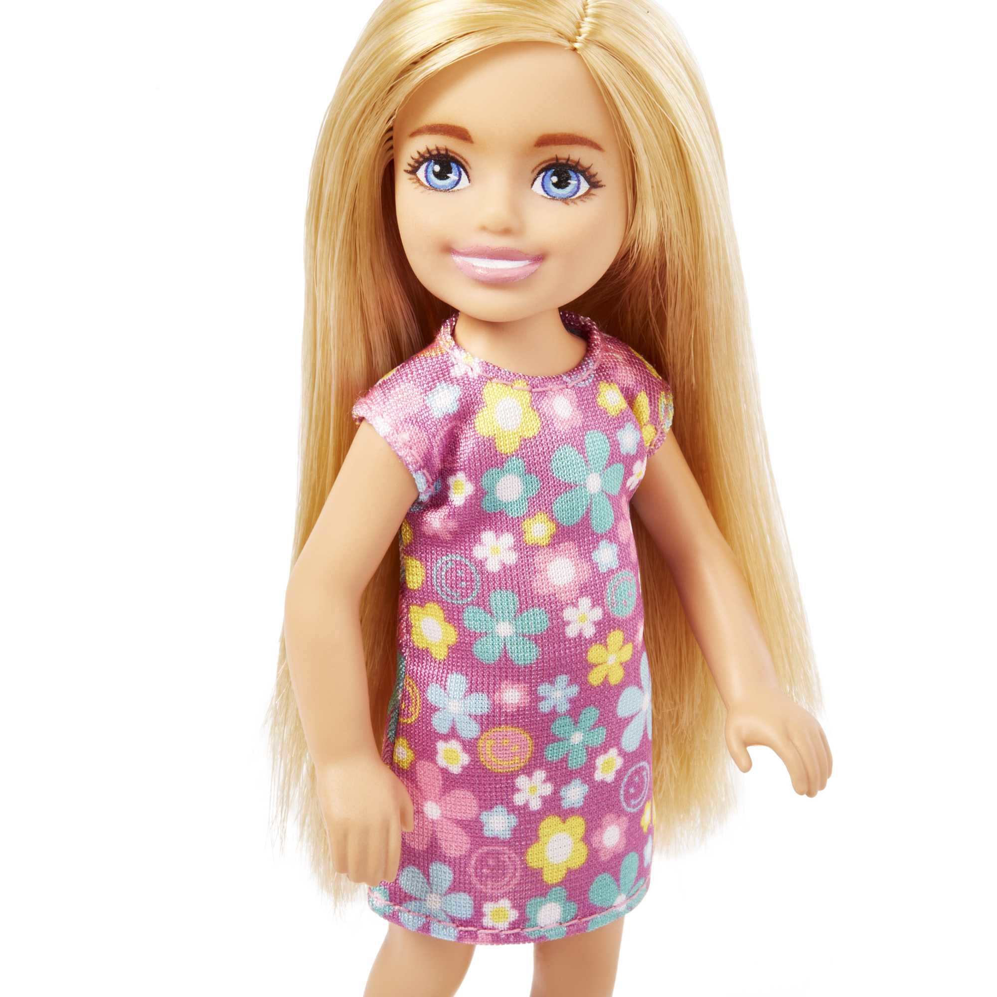 Eine blonde Puppe in einem geblümten Kleid.