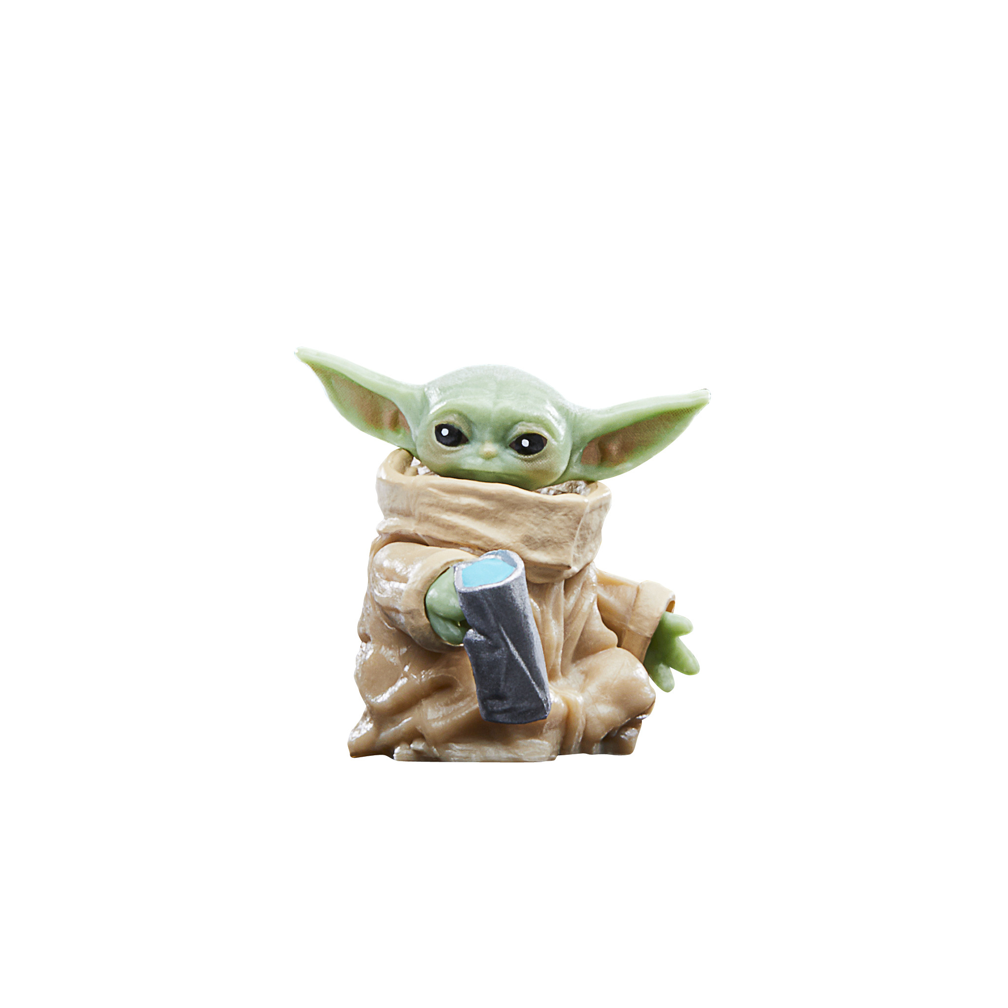 Statuetta di Baby Yoda con un dispositivo blu. Orecchie verdi, tunica beige e occhi neri.