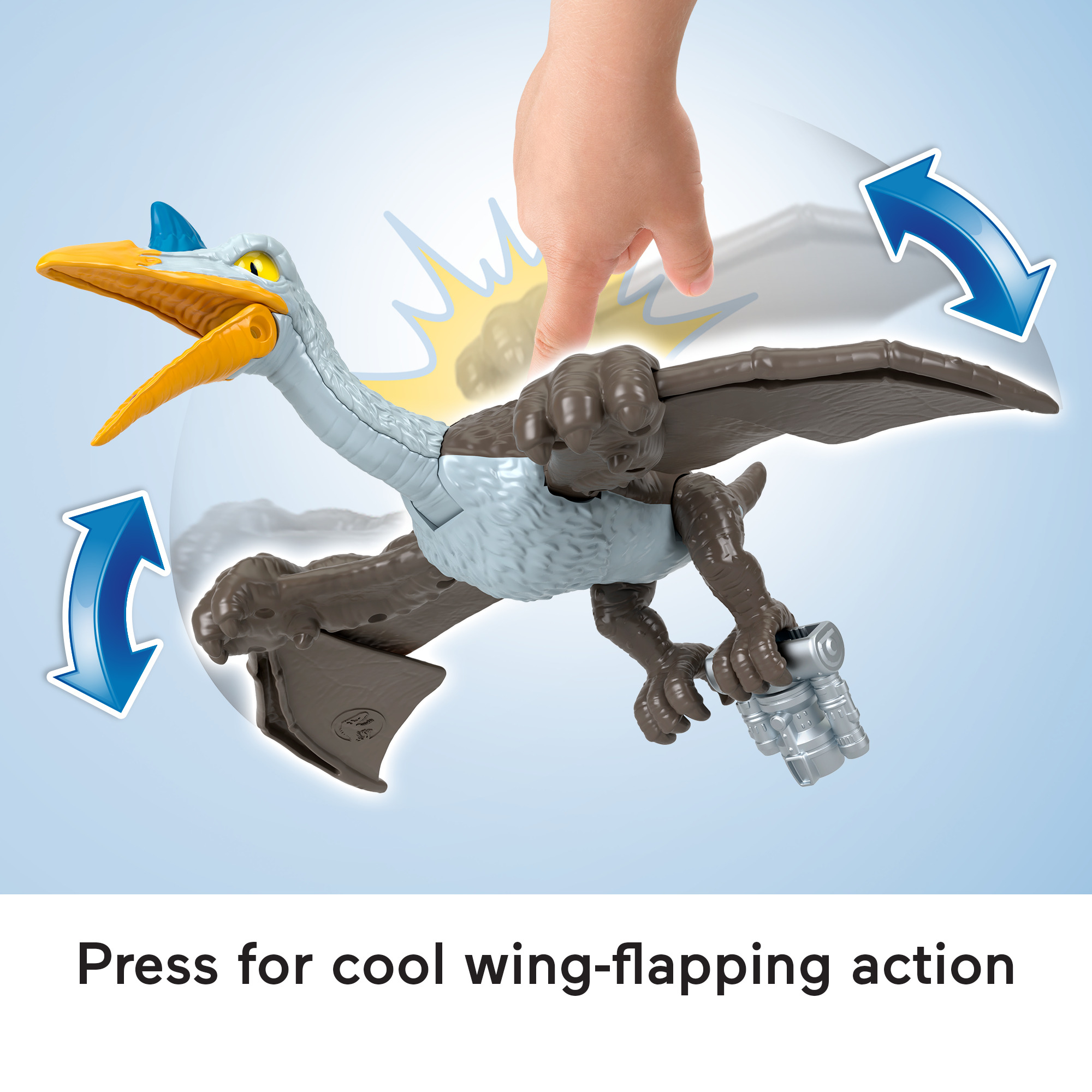 Ein Spielzeug-Pterodaktylus mit der Hand eines Kindes, das damit interagiert.