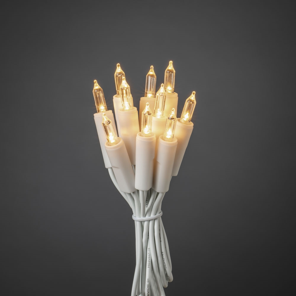 Catena di luci con diverse piccole luci, filo bianco e sfondo scuro.