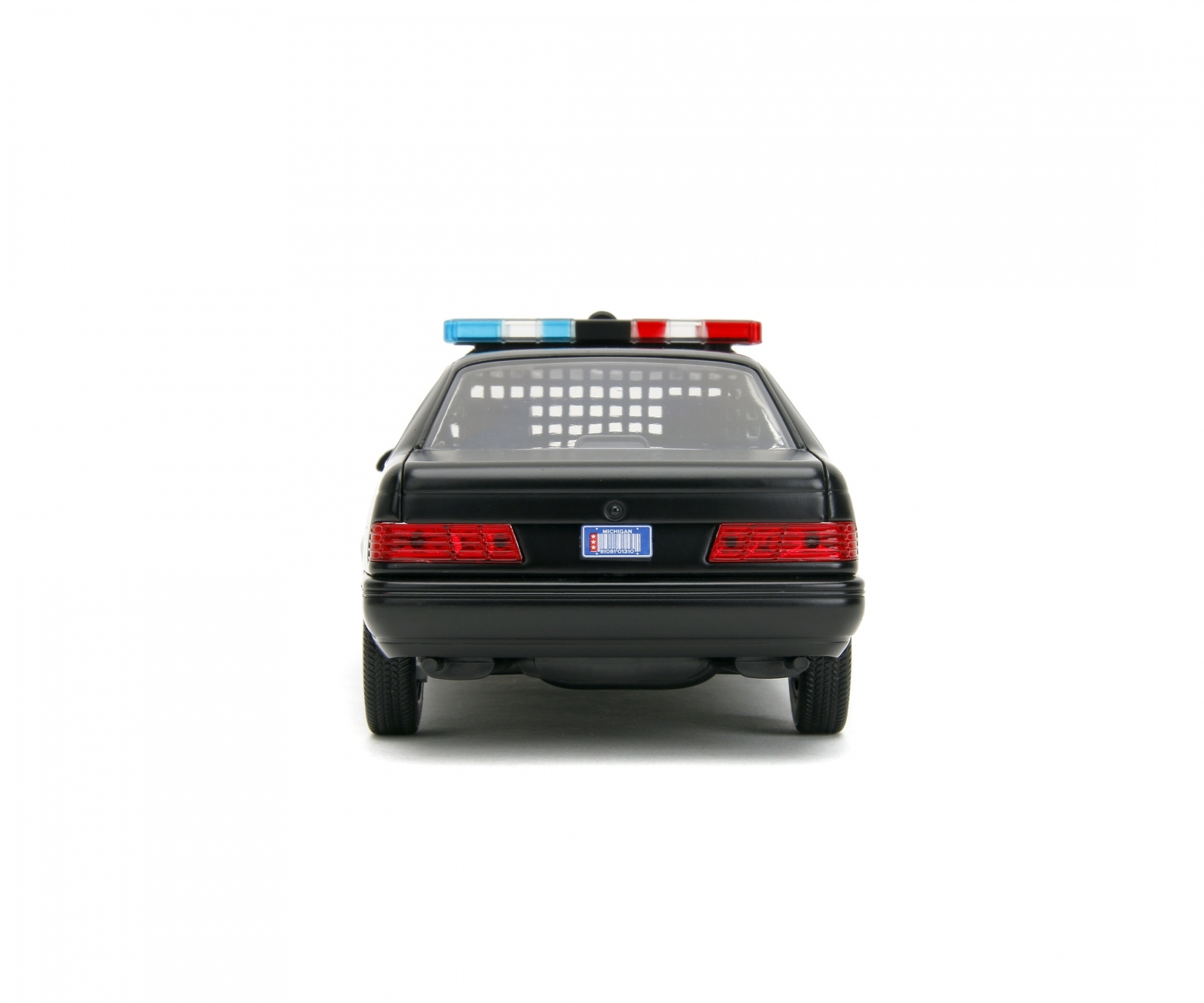 La parte posteriore di un'auto della polizia giocattolo nera con luci rosse e blu sulla parte superiore.