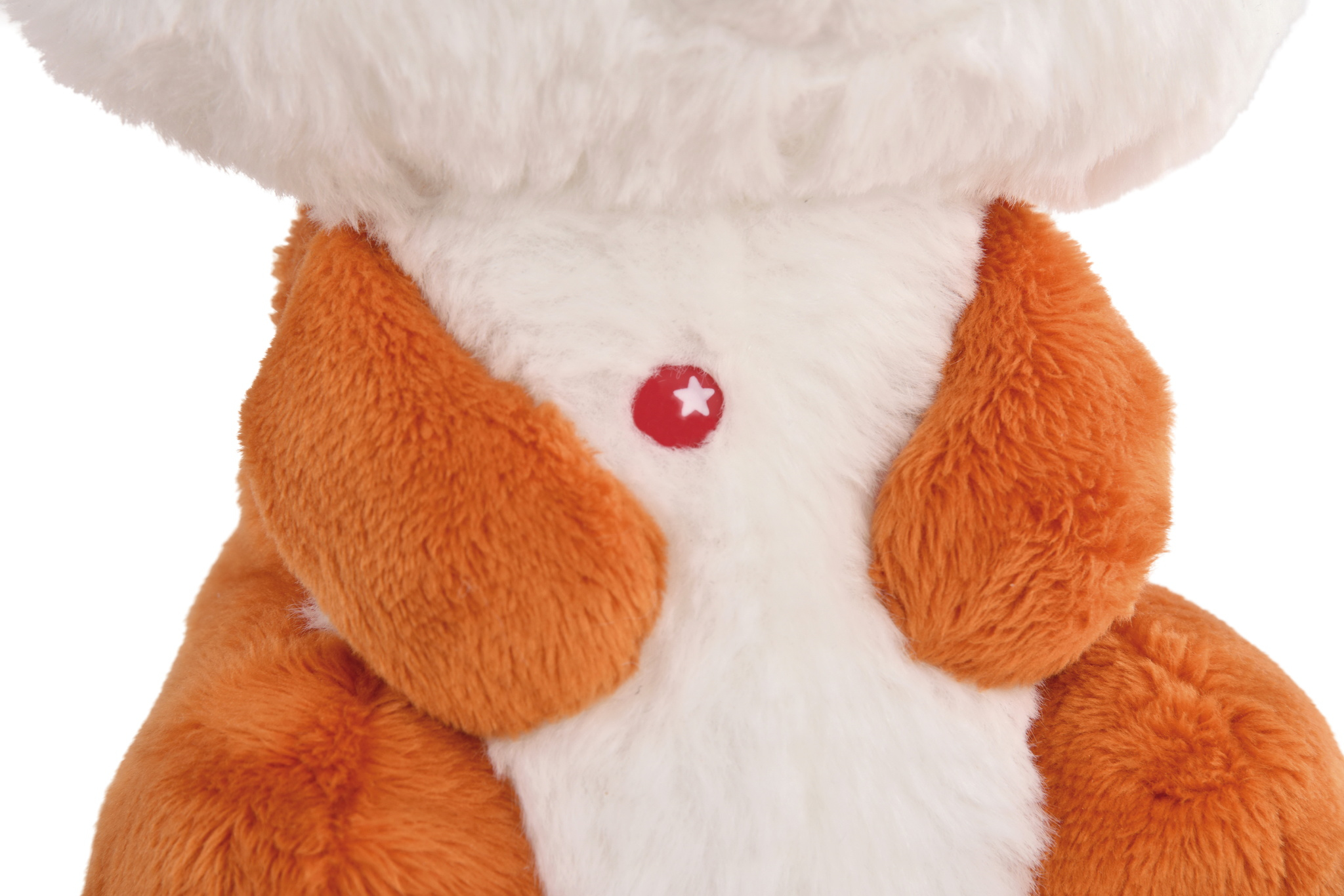 Pomarańczowo-biały pluszowy pies, z czerwonym sercem i gwiazdą na piersi.
