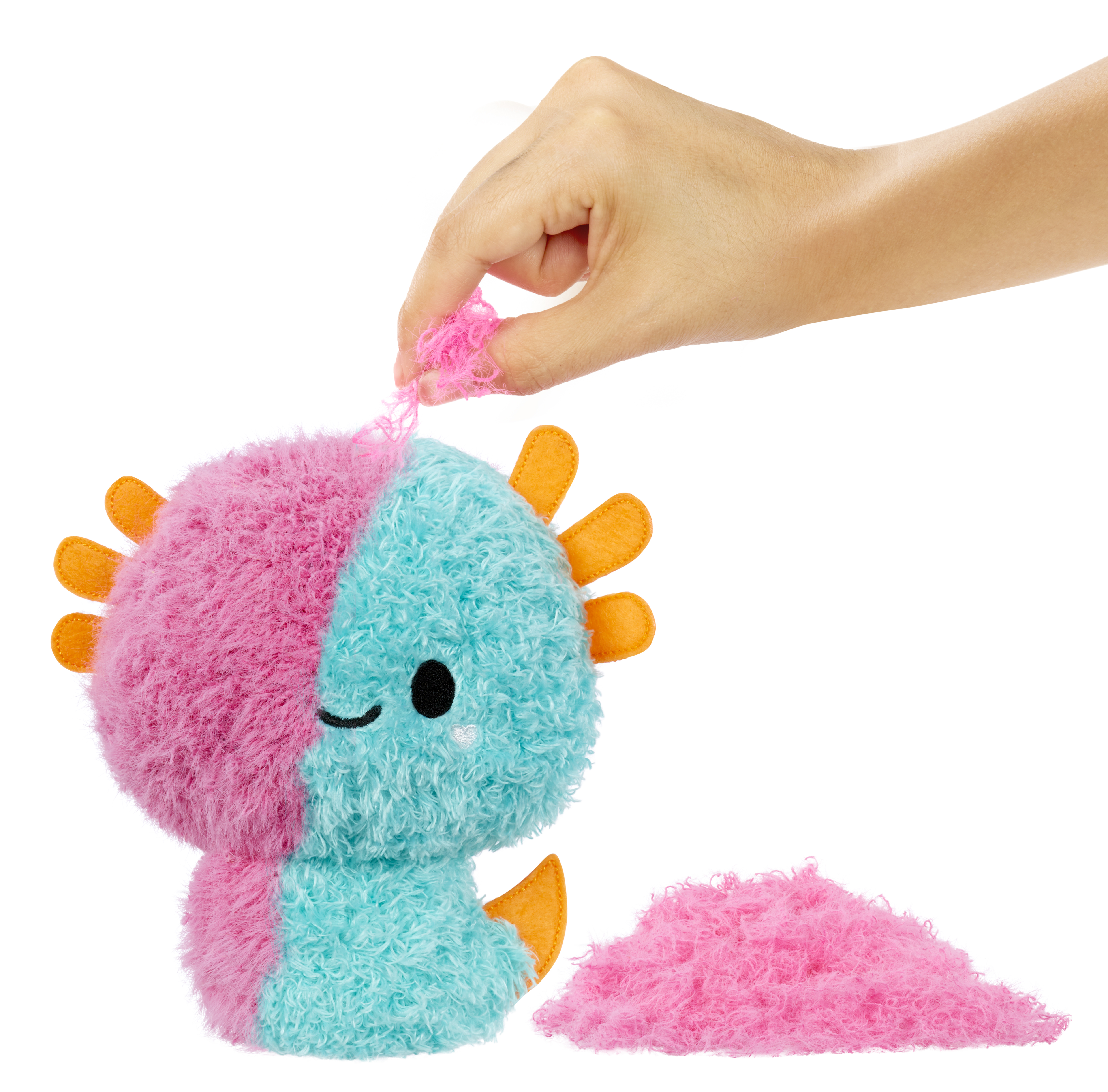 Pluszowa zabawka rozrywana, pokazująca dwa kolory. Białe tło.