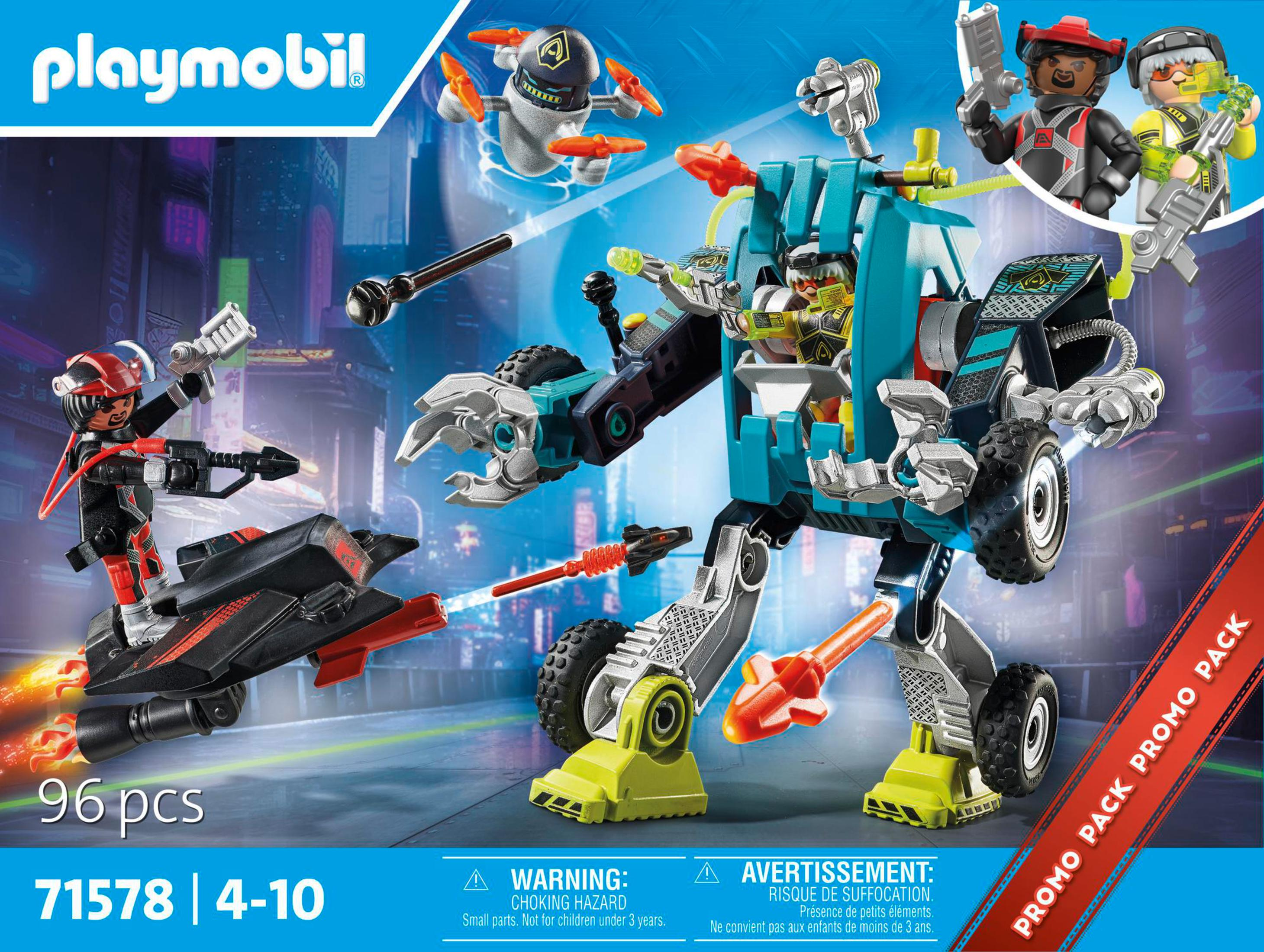 Pudełko zestawu Playmobil z futurystyczną sceną robotów i postaci, z tekstem i ostrzeżeniem.