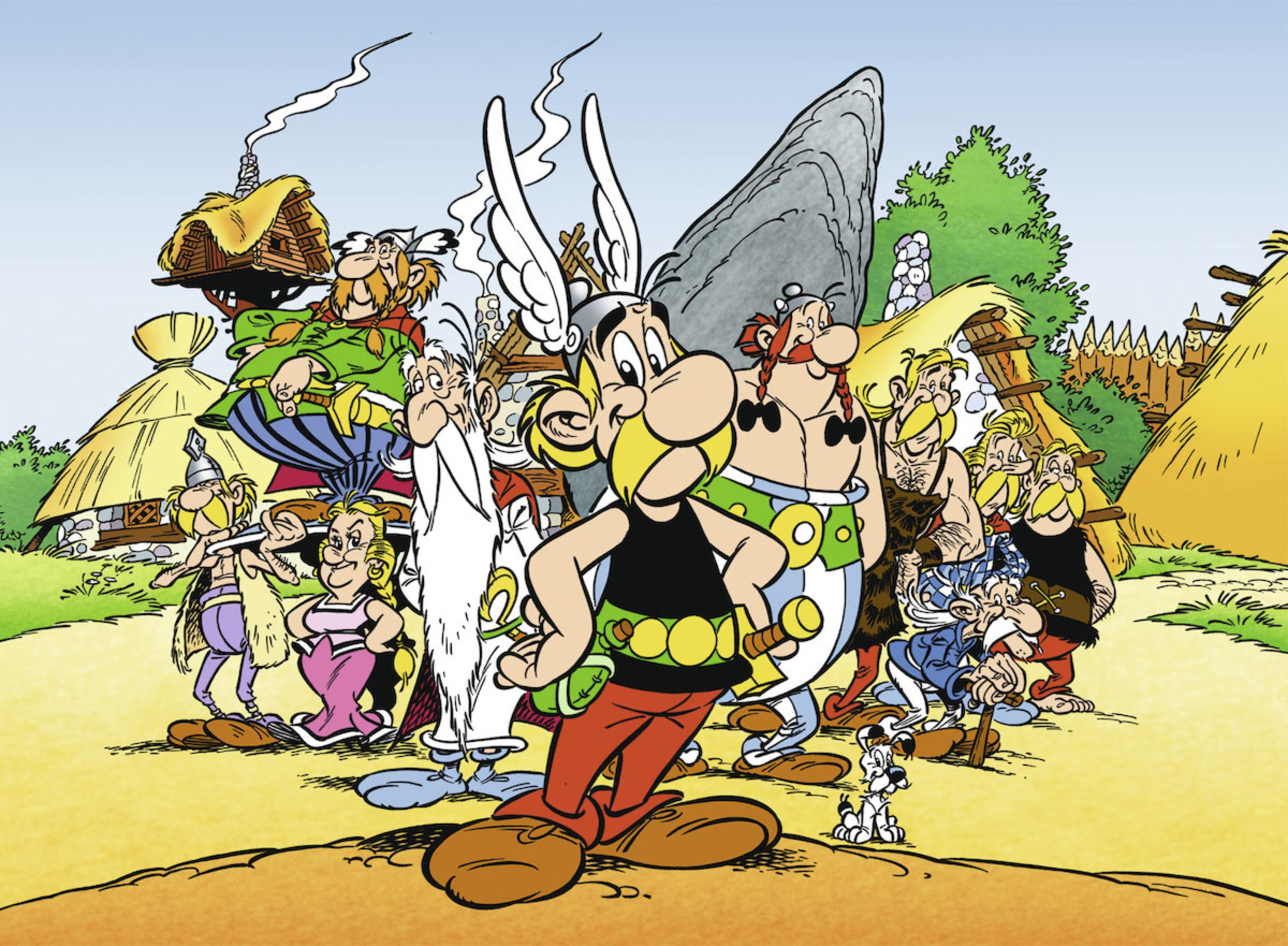 Asterix- und Obelix-Charaktere in einer Zeichentrickszene, die zusammen in einem Dorf stehen.