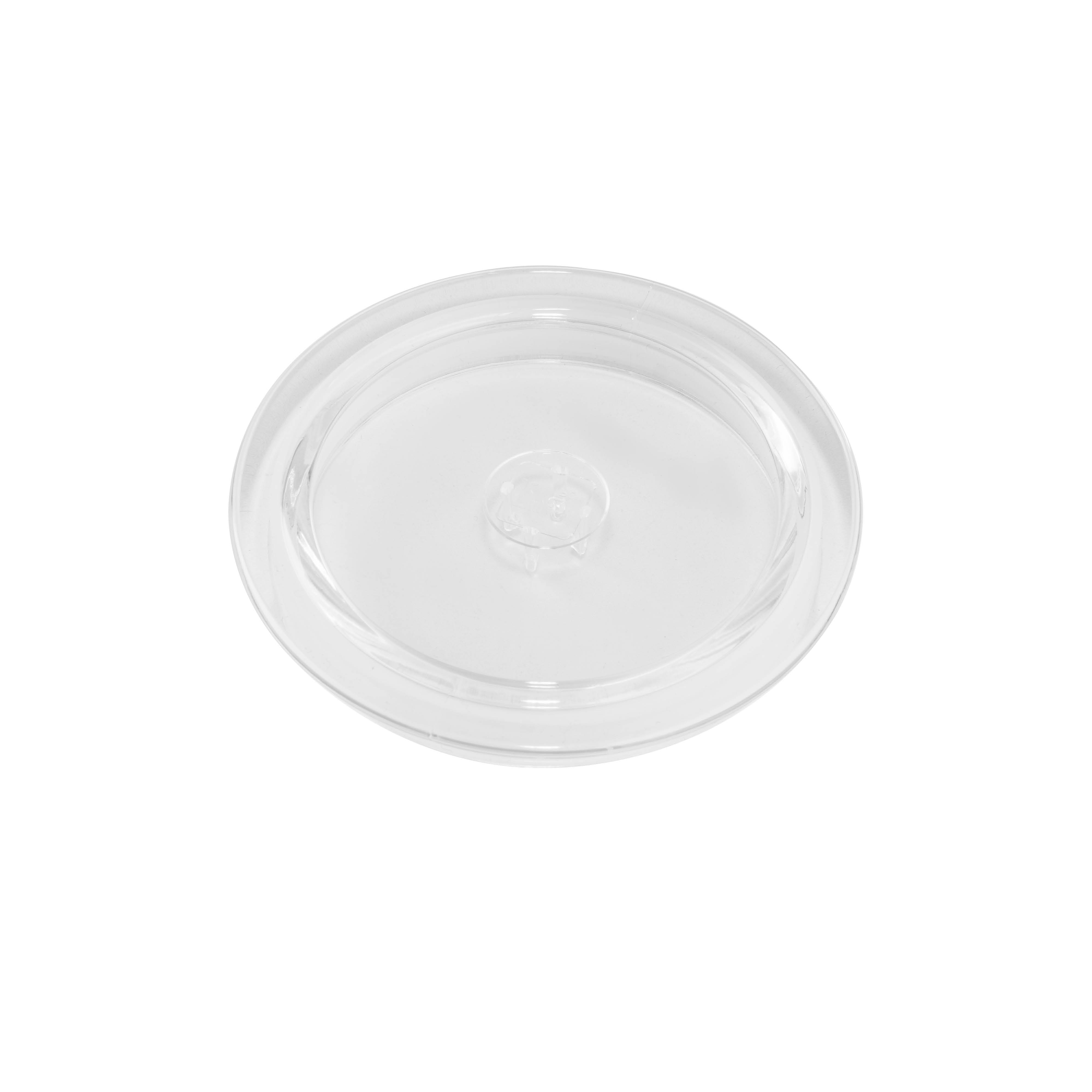 A clear plastic lid. It is circular with a raised, circular center.