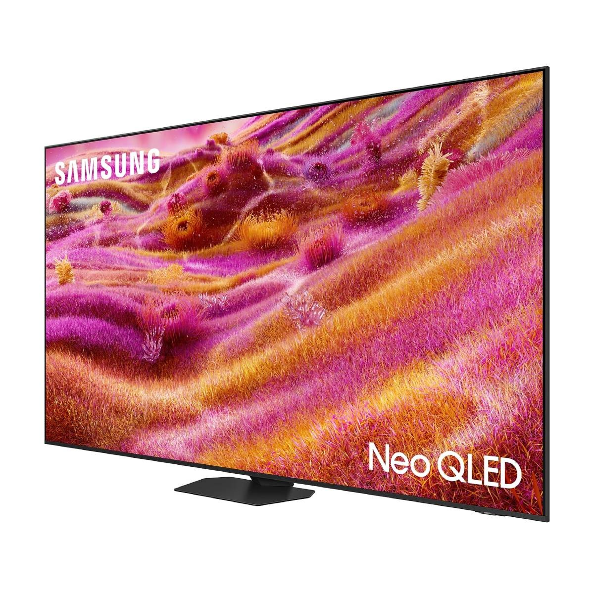 TV Samsung Neo QLED su un supporto nero. Lo schermo mostra un'immagine floreale astratta e colorata.