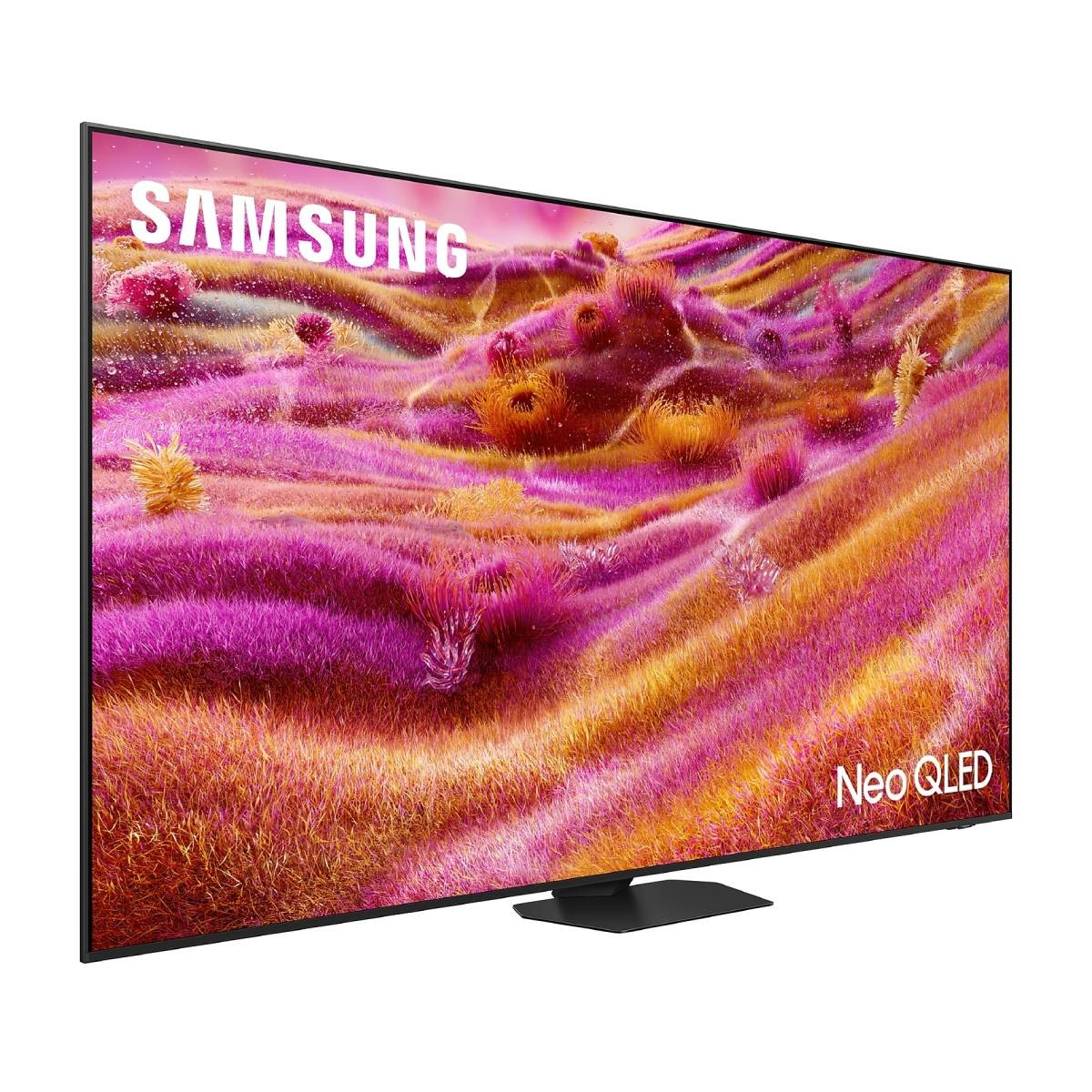 TV Samsung Neo QLED su un supporto nero. Lo schermo mostra un'immagine floreale astratta e colorata.