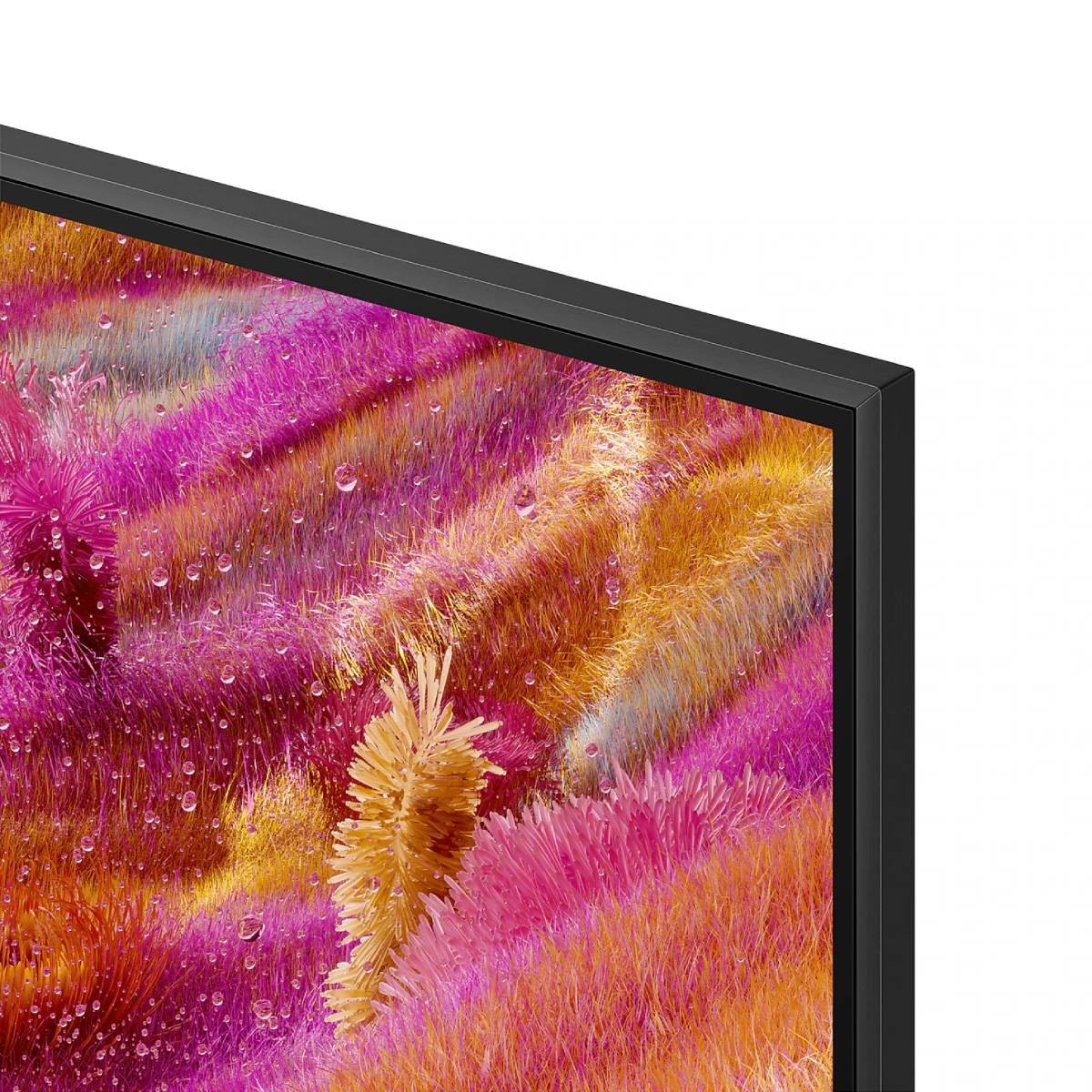 Primo piano di uno schermo TV che mostra un display astratto colorato con tonalità rosa, arancione e giallo.