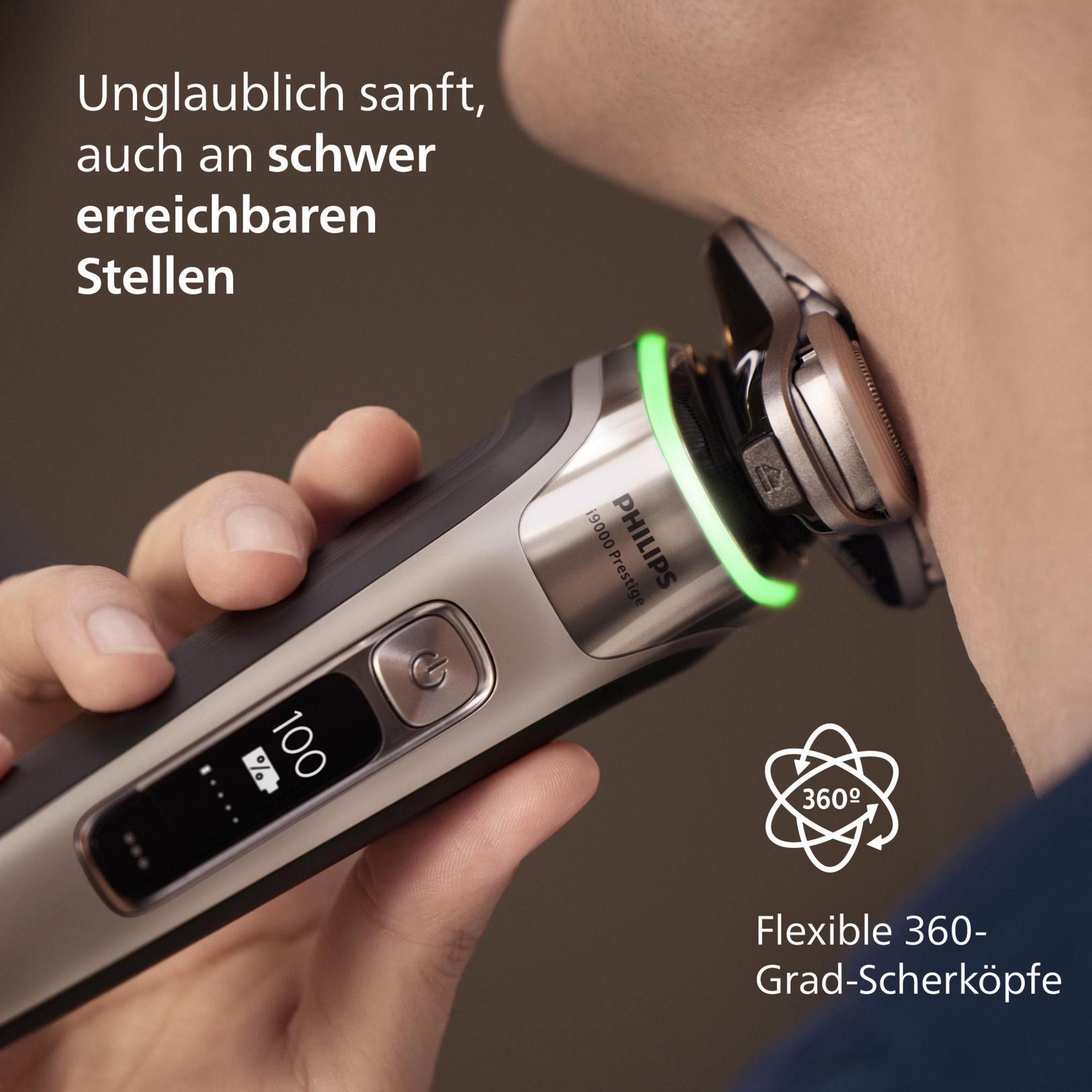 Ein Philips Rasierer und Zubehör: Etui, Ladegerät und zwei Cremes.