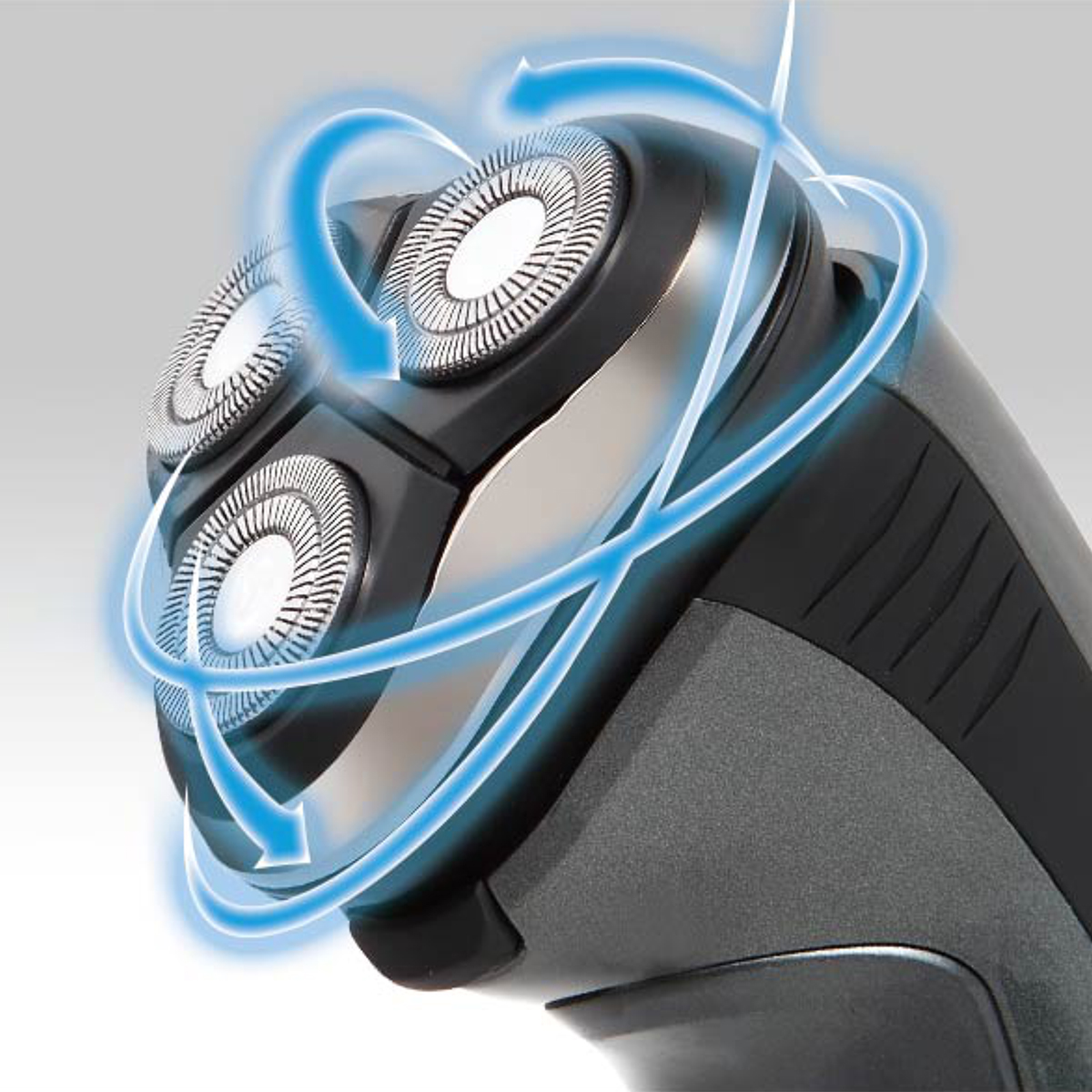 Zbliżenie na głowice golarki elektrycznej z niebieskimi wirującymi strzałkami wokół nich.