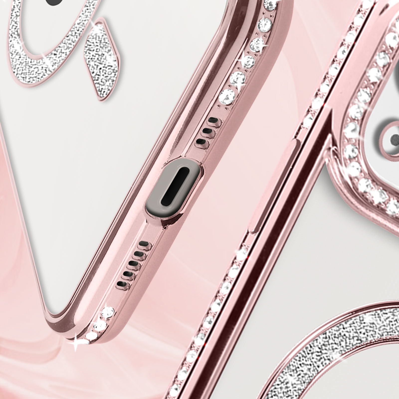 Custodia oro rosa con strass. Mostra bordo e area fotocamera con strass.