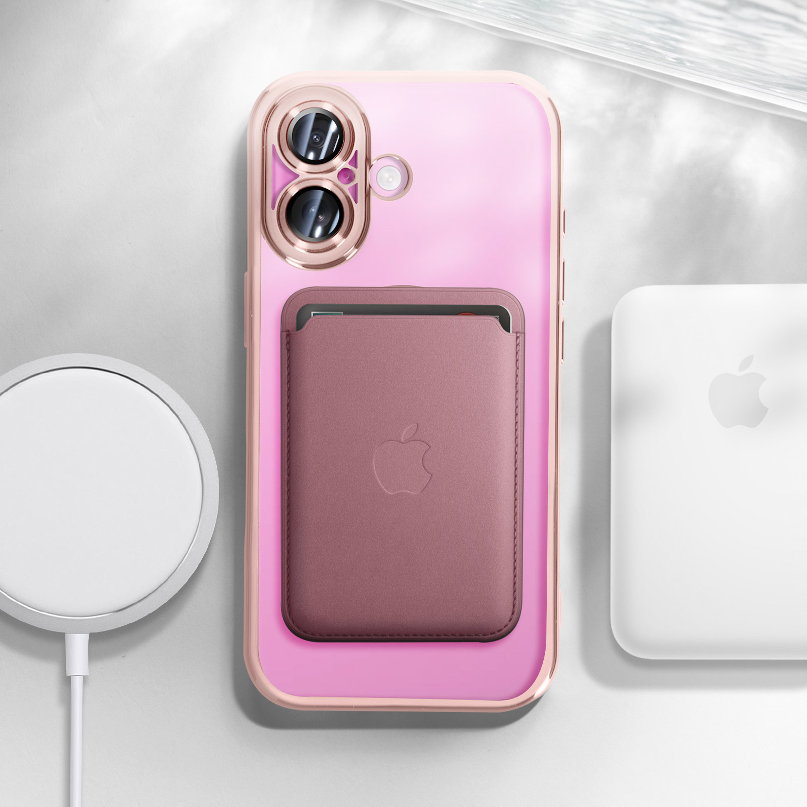 Custodia rosa per telefono con portacarte, caricatore bianco, accessorio Apple.