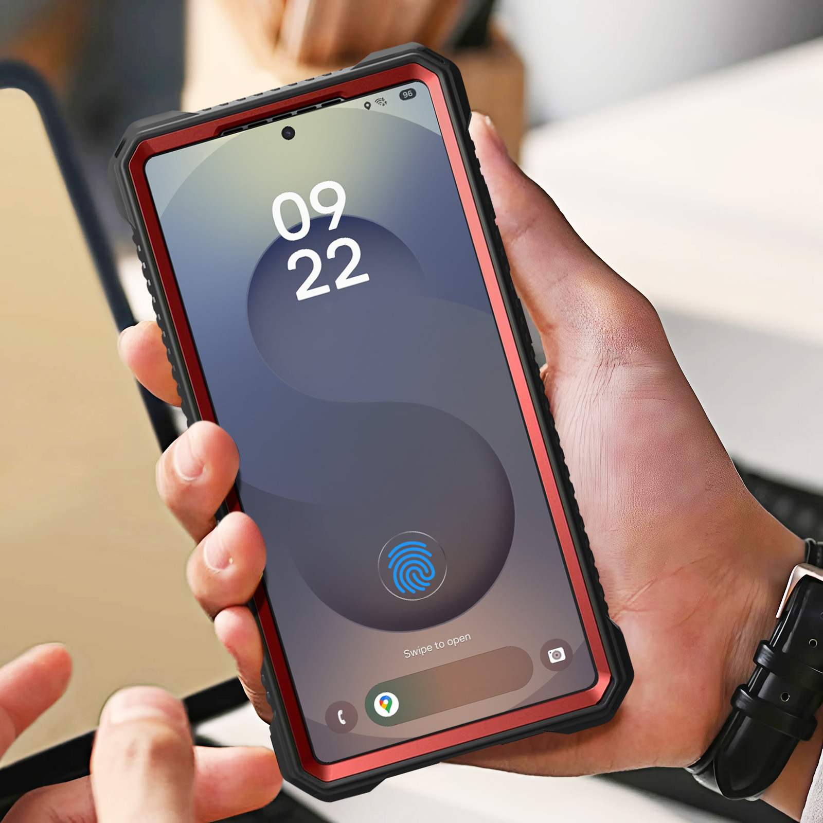 Telefono in una custodia rossa, che mostra la data 09 22 e un'icona di impronta digitale.