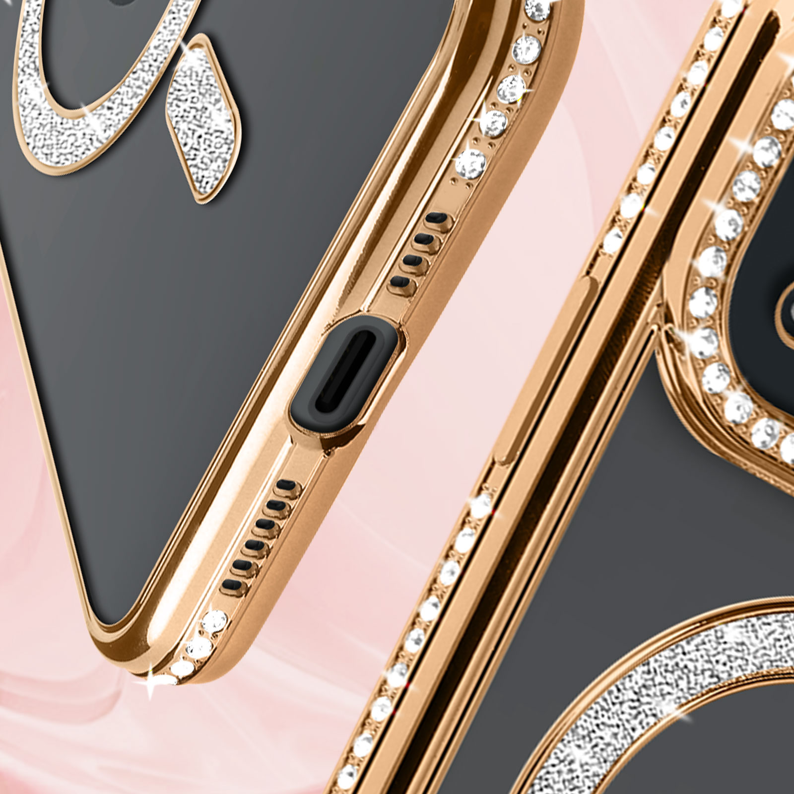 Primo piano di una custodia con cornice dorata e strass. Logo Apple visibile.