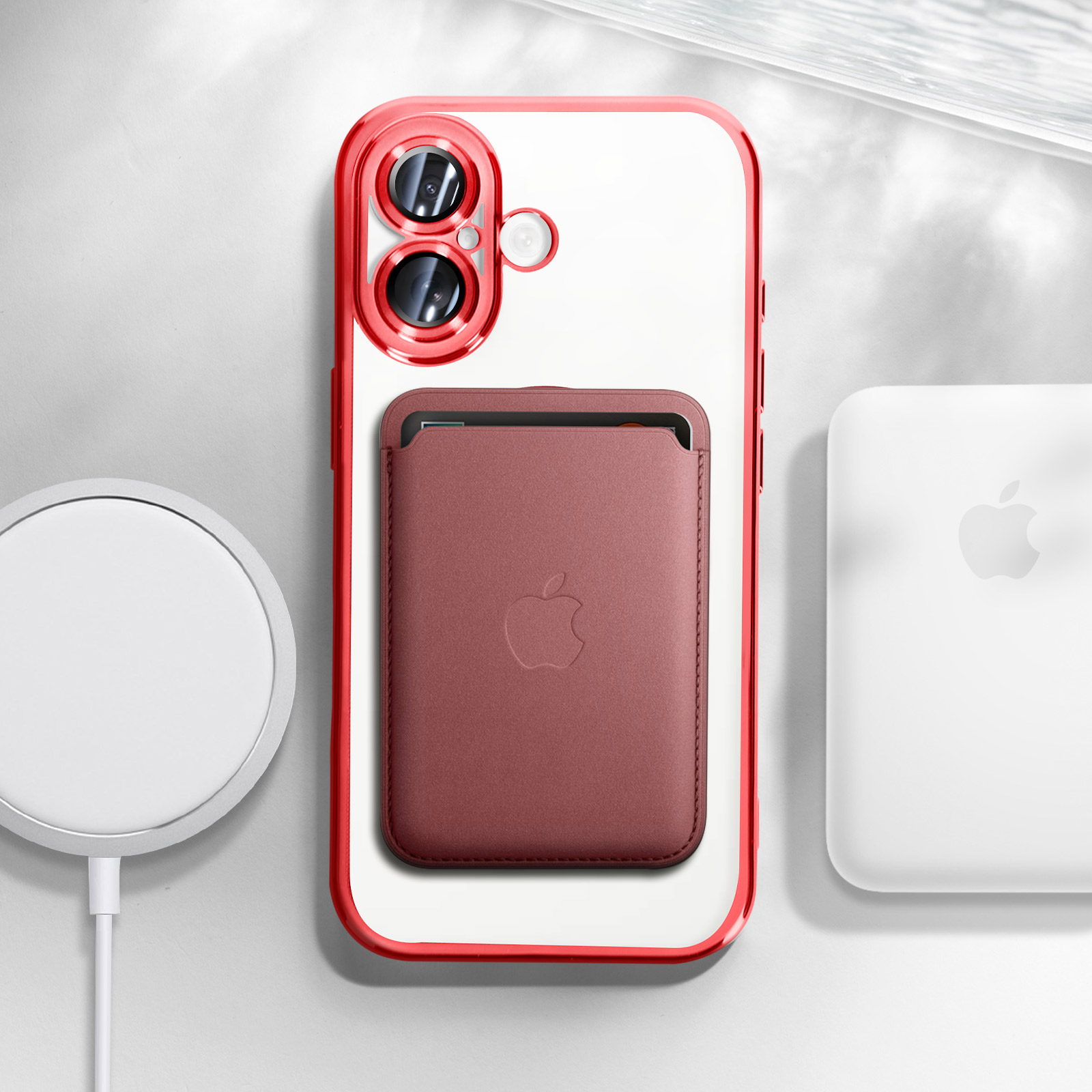 Custodia rossa con cornice rossa, che tiene un portafoglio rosso con logo Apple e base di ricarica.