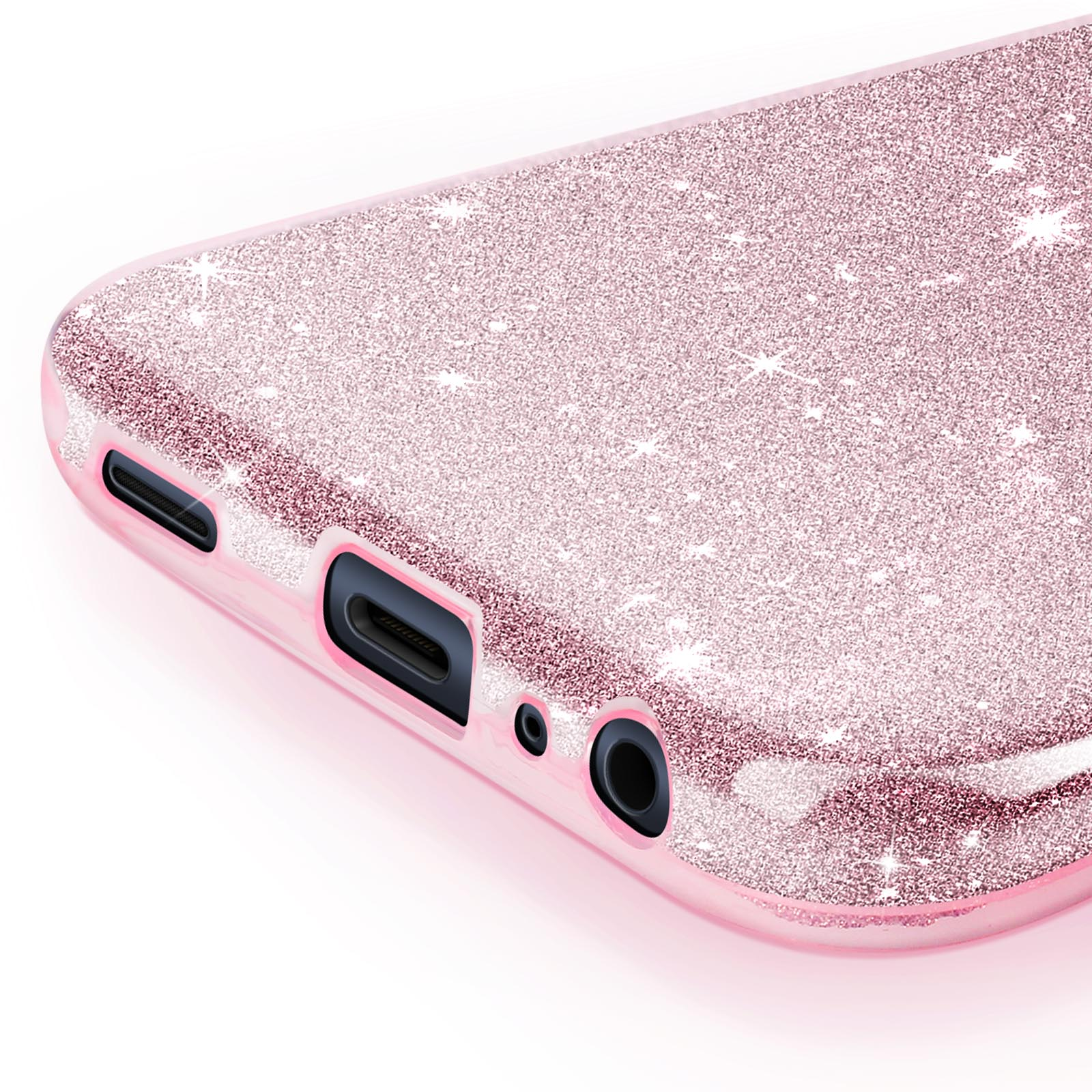 Primo piano di una custodia per telefono rosa glitterata. Porta di ricarica e jack per cuffie.