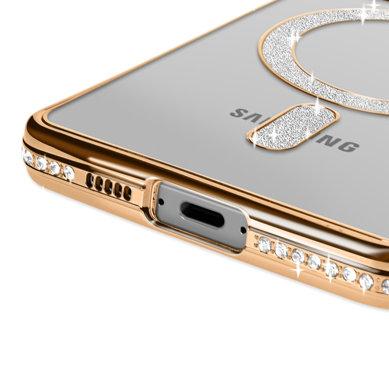 Primo piano di una custodia per telefono con cornice dorata e strass. Superficie nera.