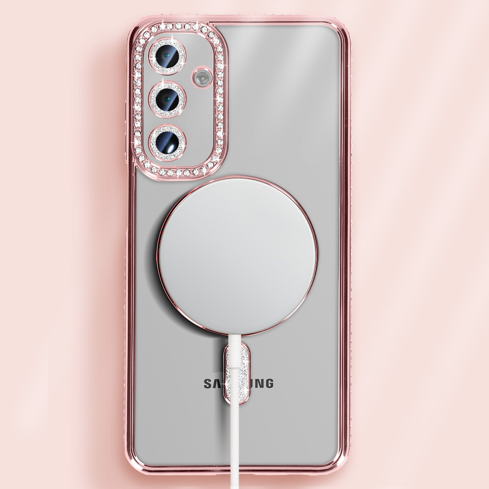 Téléphone et coque; coque rose avec diamants et cercle de charge blanc.