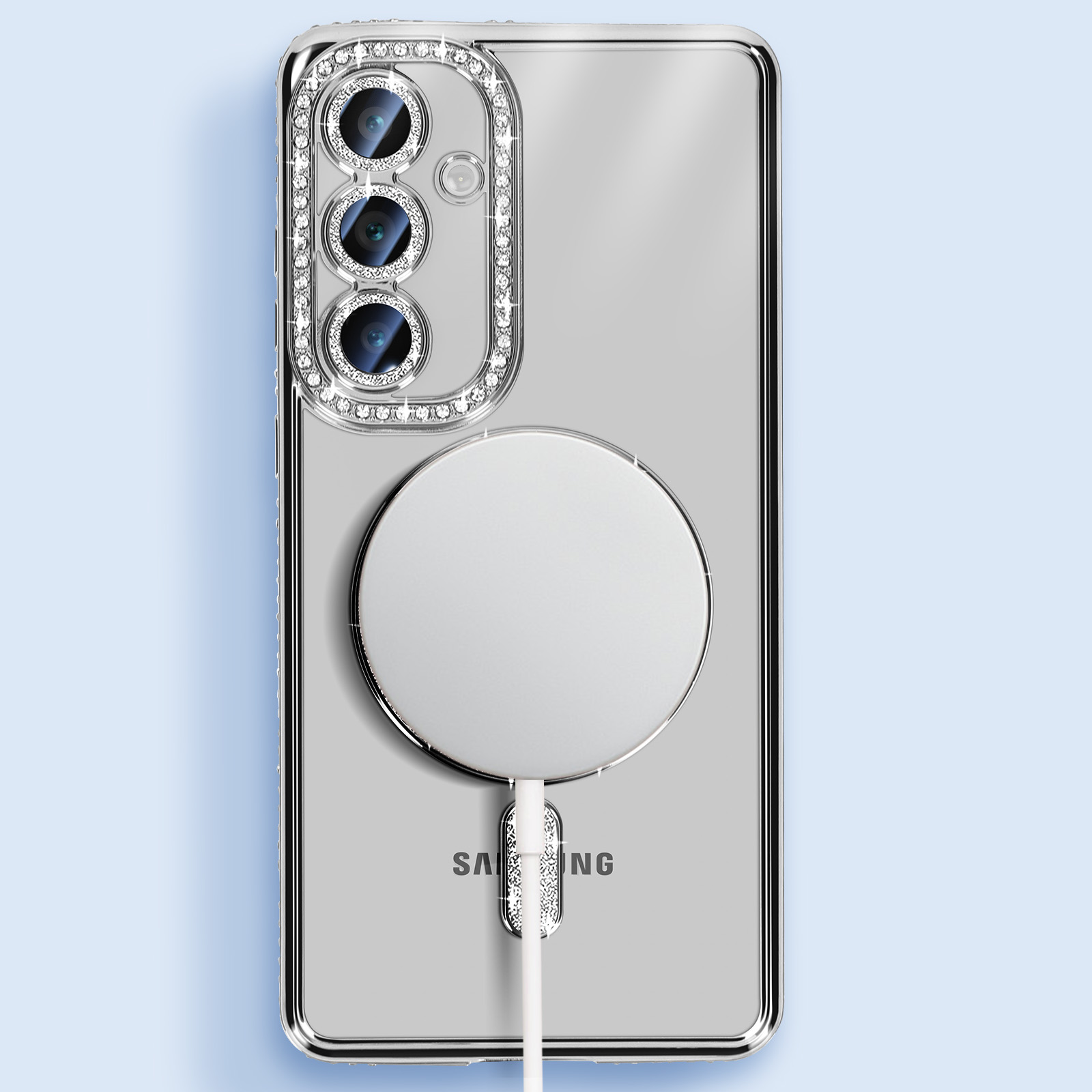 Un telefono argentato con una custodia trasparente, diamanti e un caricatore bianco.