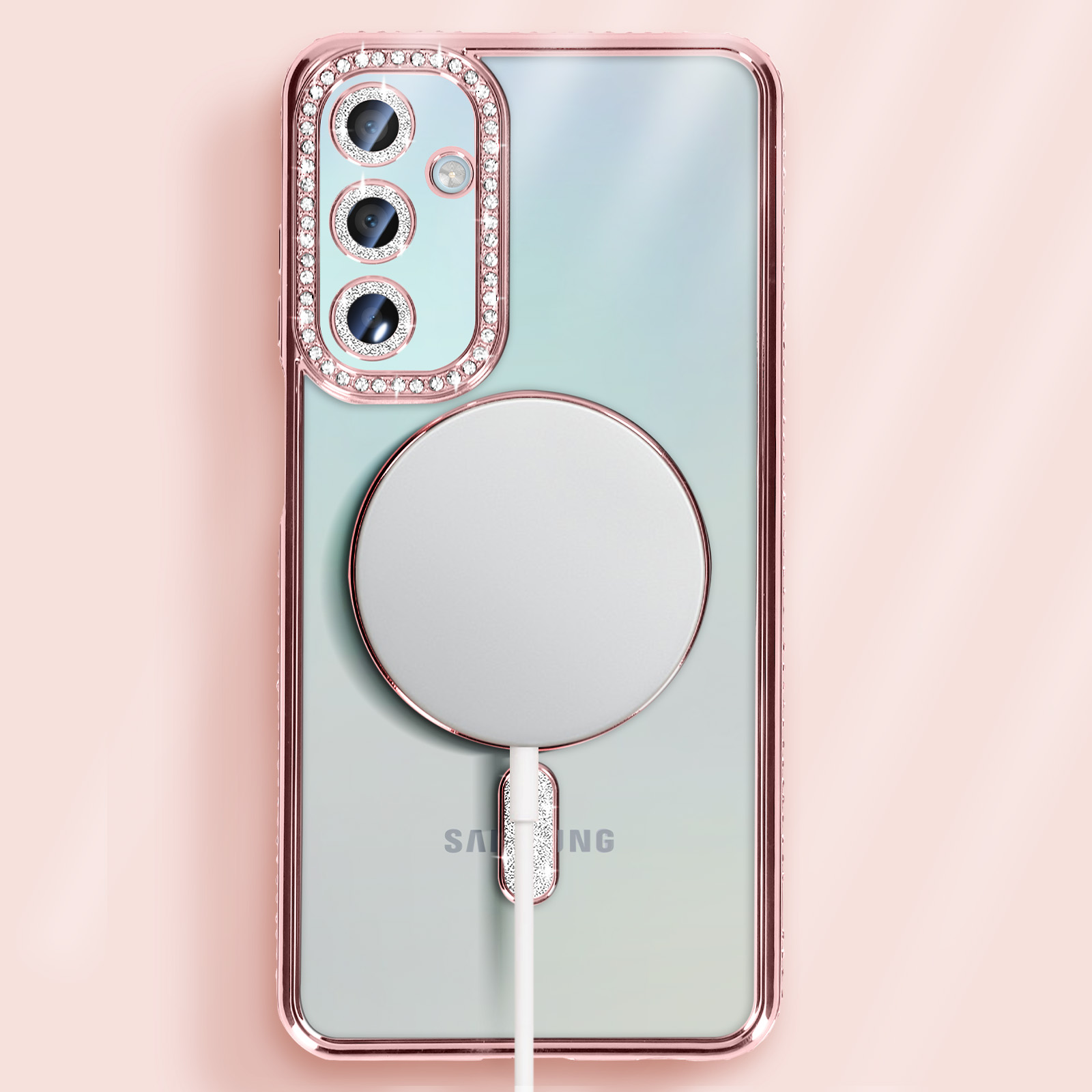 Telefono Samsung con custodia rosa diamante e caricabatterie circolare bianco collegato.