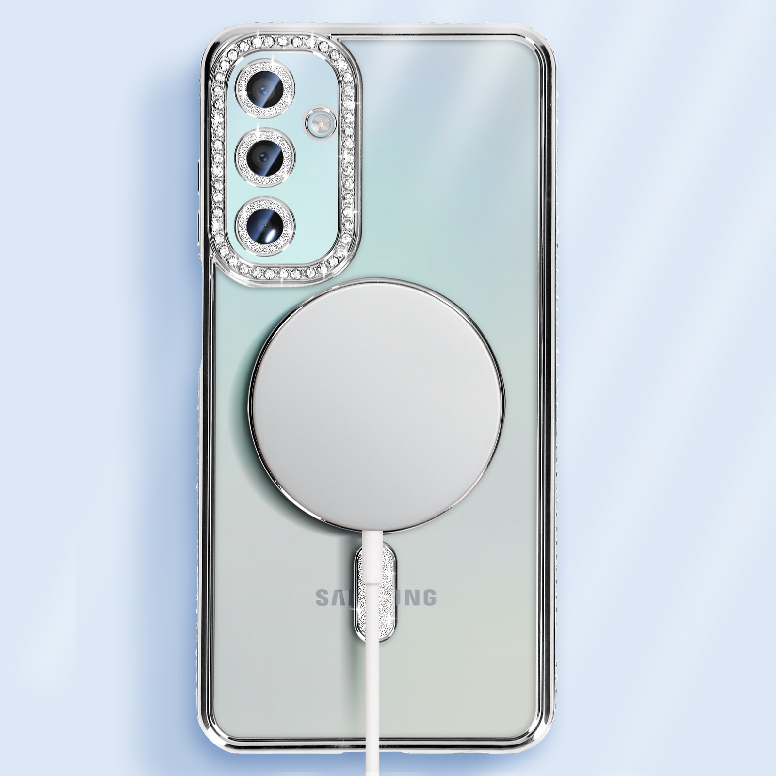 Custodia trasparente con dettagli diamantati, telefono argento e caricatore magnetico.