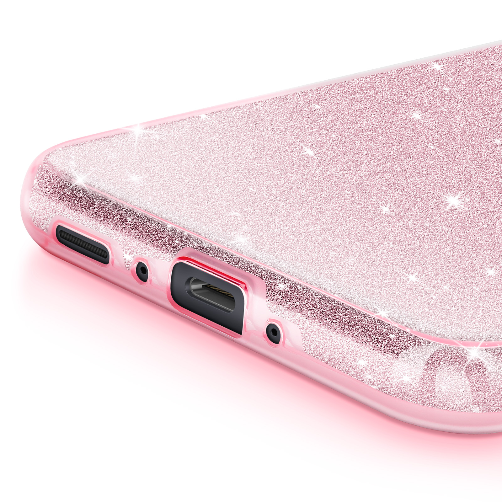Primo piano della custodia rosa glitterata. Mostra la porta di ricarica e un telefono.