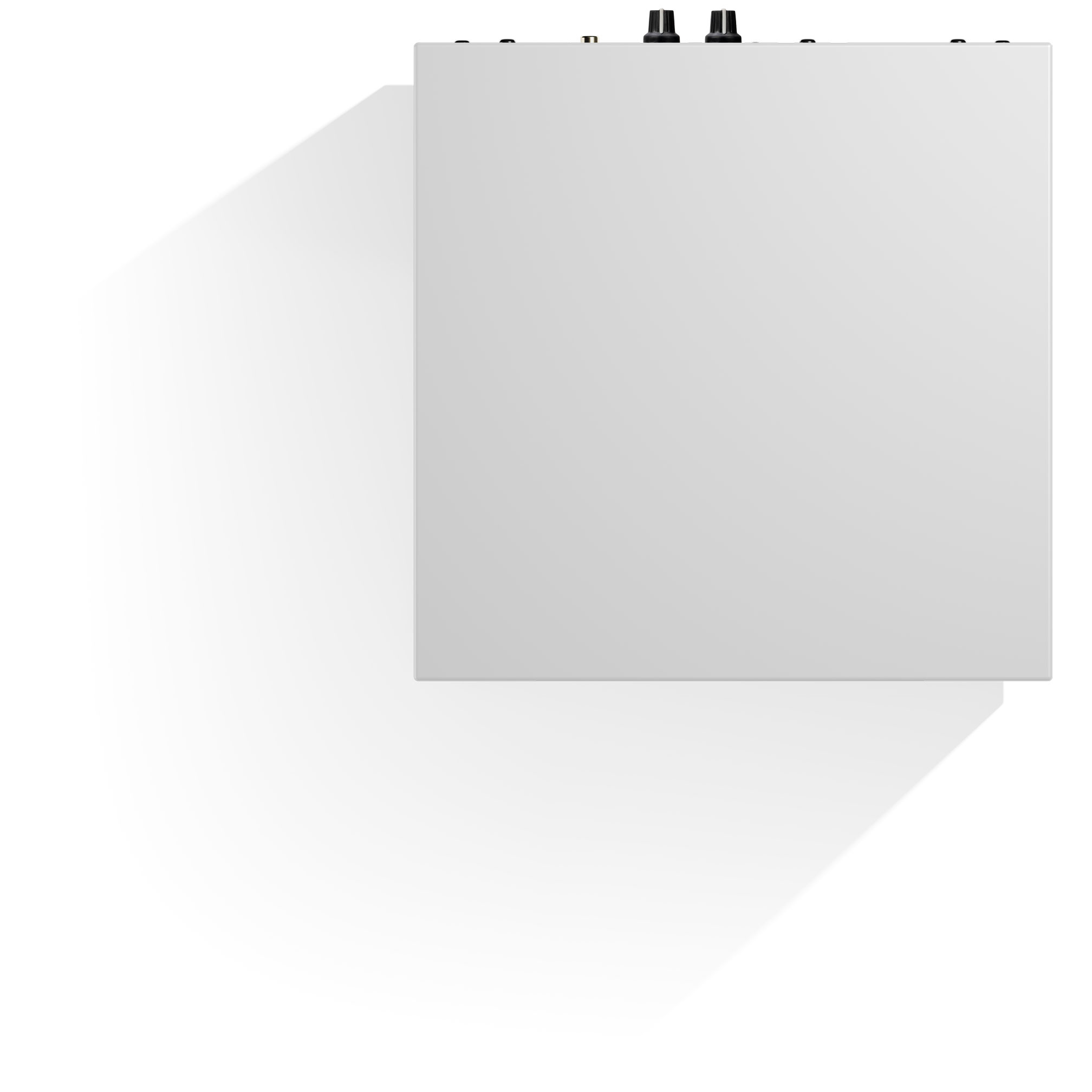 Top-down view of a white, rectangular device. Two black knobs are on the top right. A long shadow is cast on the left side.