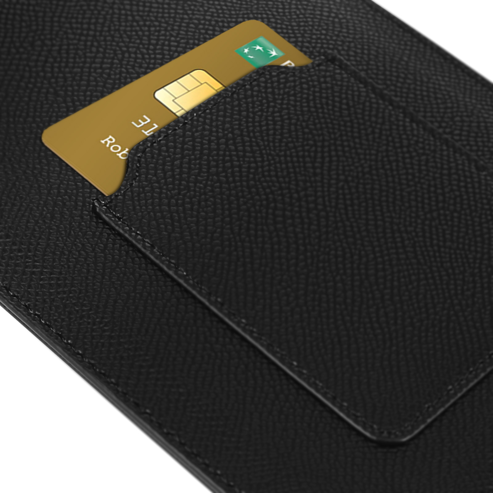 Primo piano di una carta in uno slot di una custodia nera per telefono. Carta oro visibile.