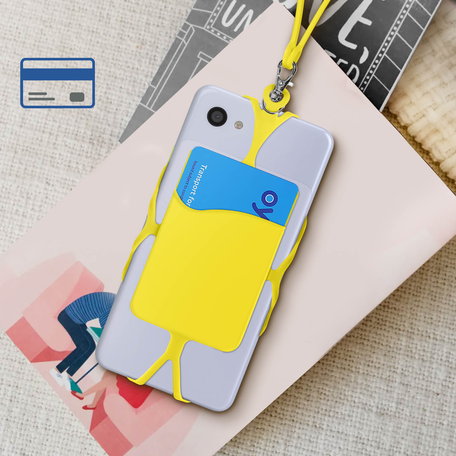 Telefono con custodia e carta gialle. La carta e la custodia sono gialle, con sfondo di libro e cappello.