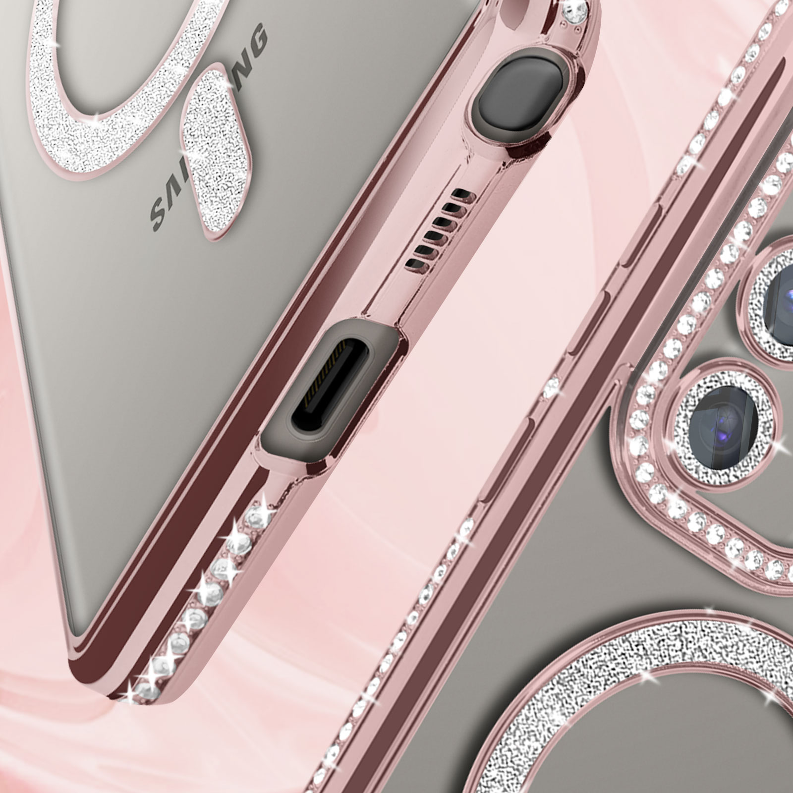 Primo piano di una custodia per telefono con cornice rosa e dettagli scintillanti.