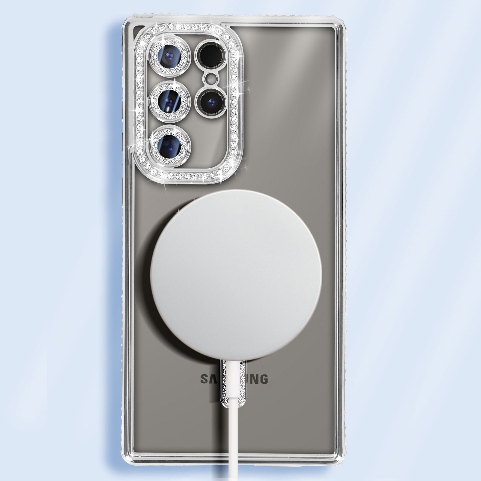 Custodia trasparente per telefono con strass e un cerchio bianco. Telefono nero all'interno.