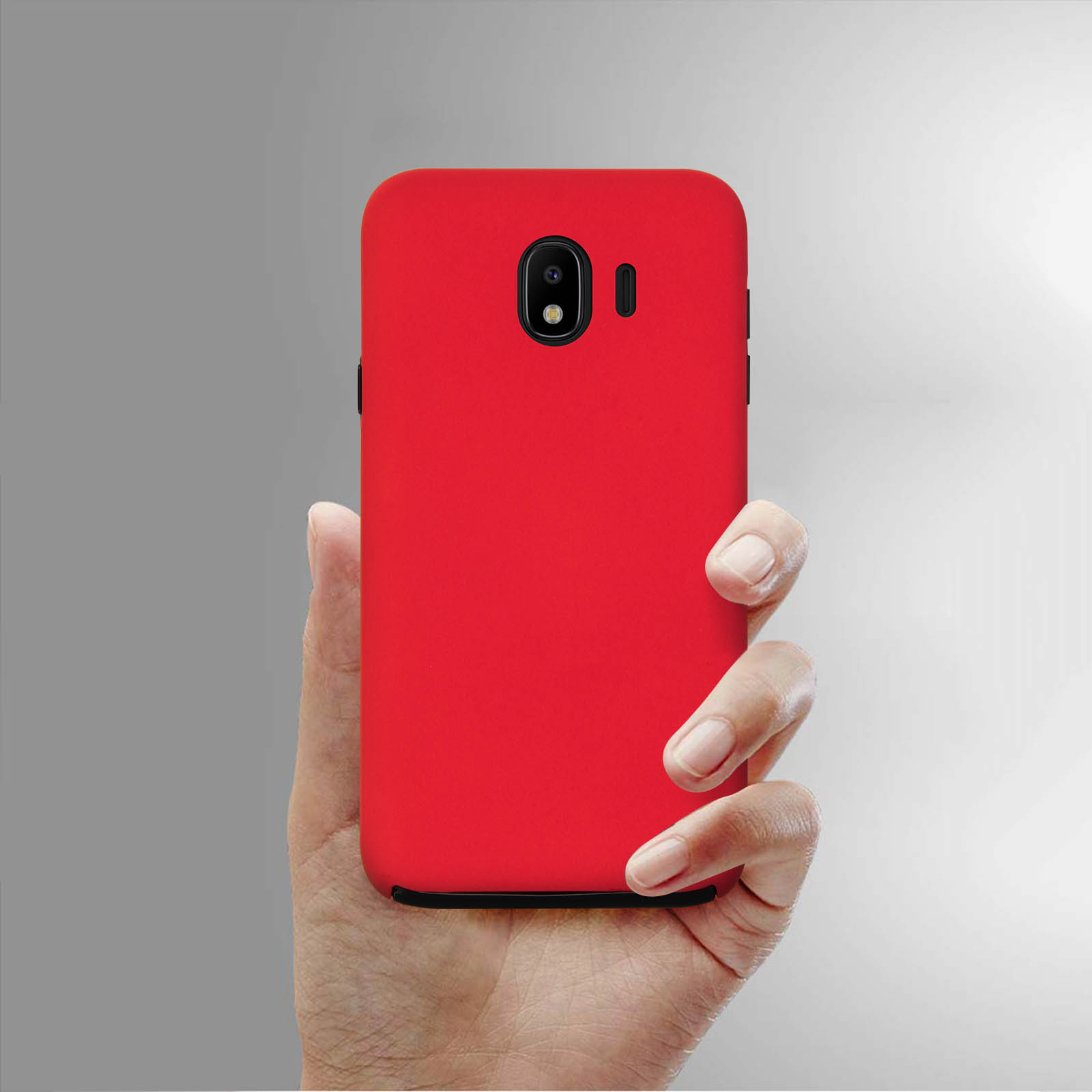 Eine Hand hält eine rote Handyhülle. Das Telefon hat eine Kamera und einen Blitz.