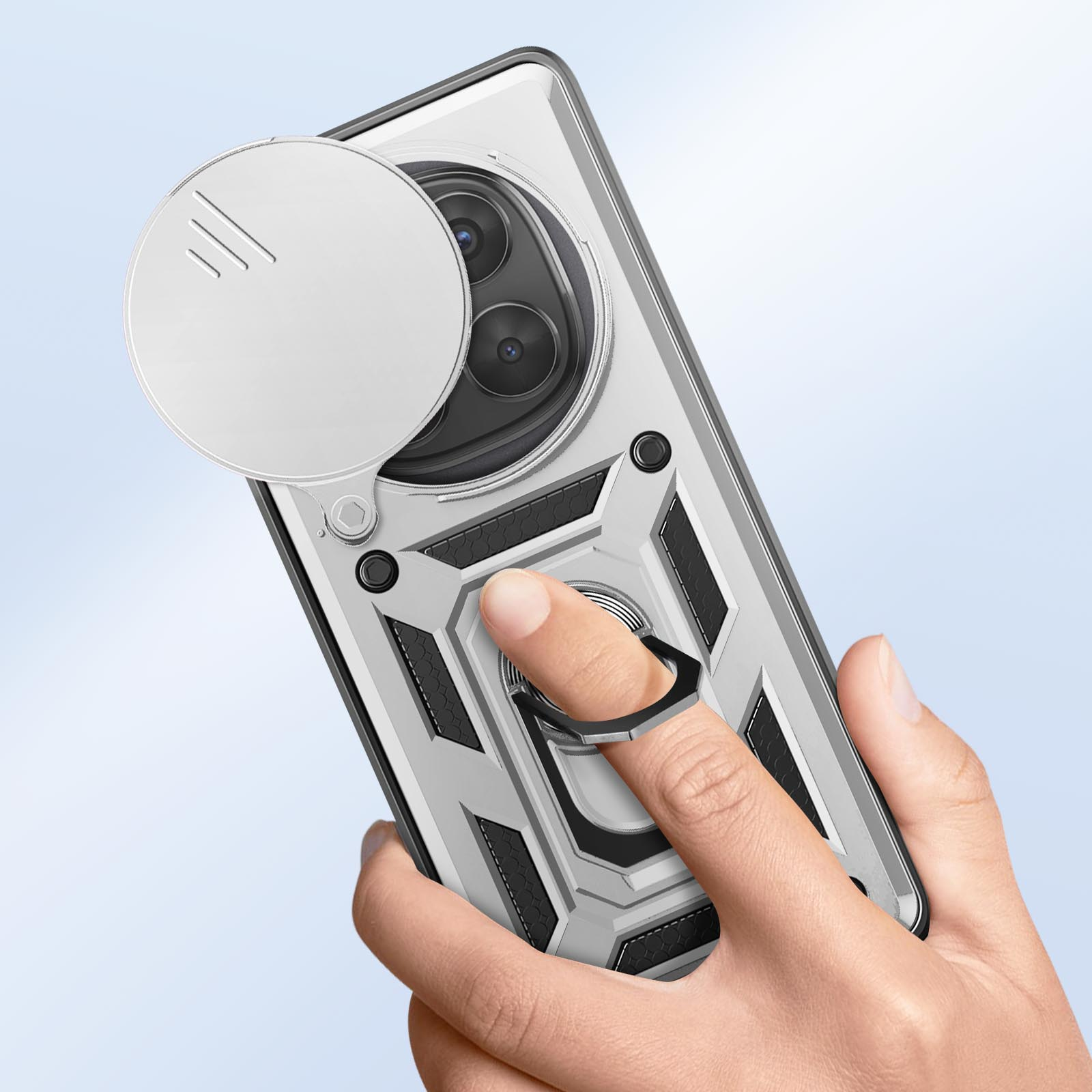 Custodia per telefono argentata con anello. Una mano tiene l'anello. Un copriobiettivo è aperto.
