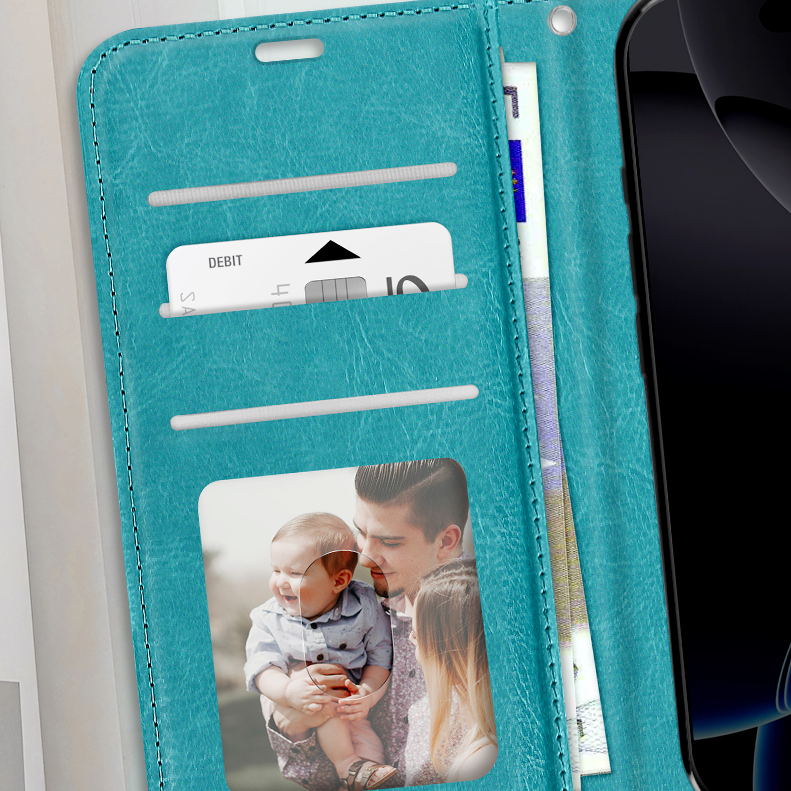 Custodia in pelle verde acqua con carte di credito, foto e telefono. Uomo con bambino nella foto.